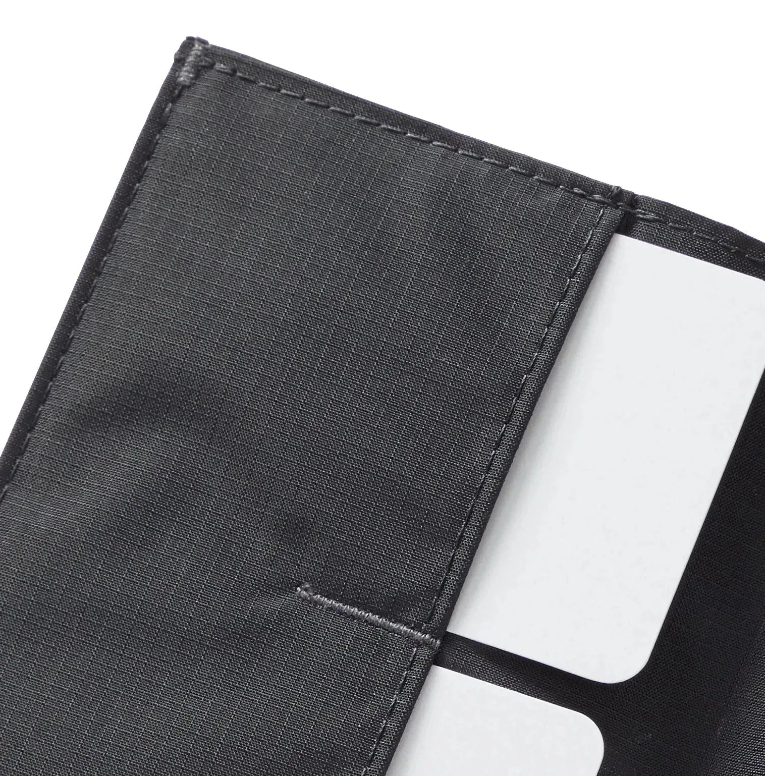 close-up of corner of the Allett Wallet coin nylon wallet in jet-black