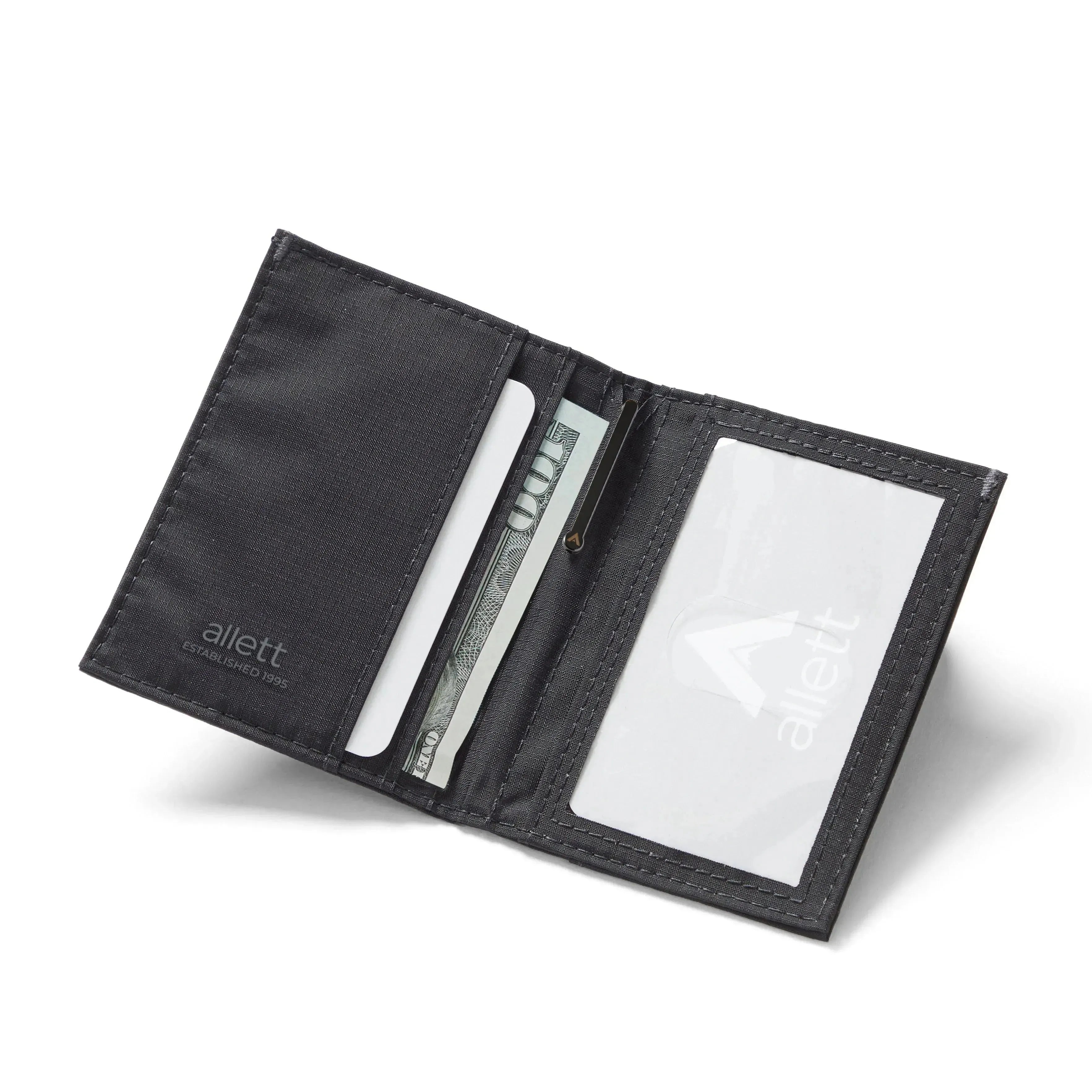 Unfolded Jet Black RFID blocking hybrid card wallet, constructed with vegan-friendly nylon, displaying card compartments and a convenient ID window. Allett Hybrid Card Wallet jet-black