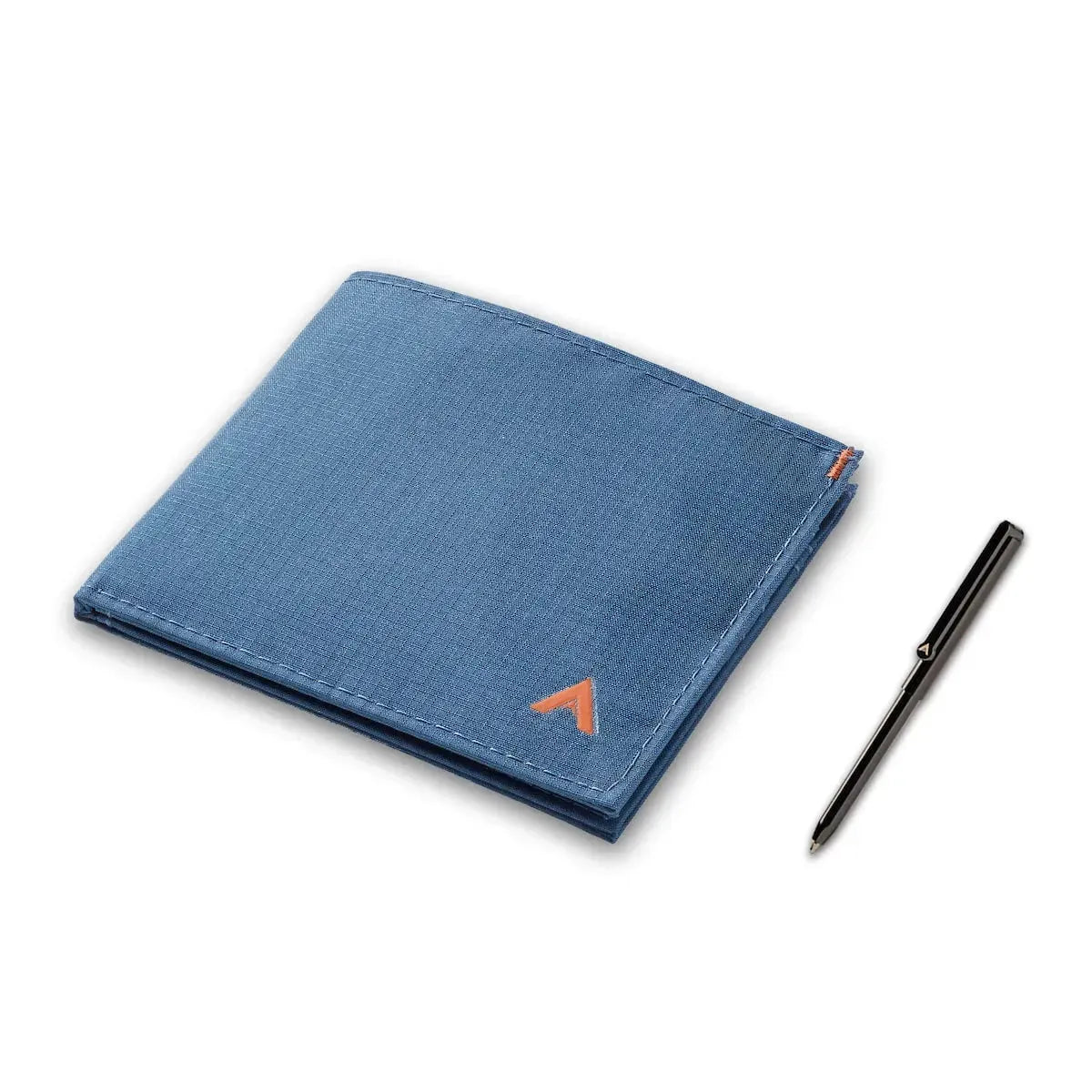 Indigo blue vegan nylon ID wallet next to a very small micro pen. Wallet has a pocket for the pen - Allett ID Wallet Nylon RFID indigo-blue pen