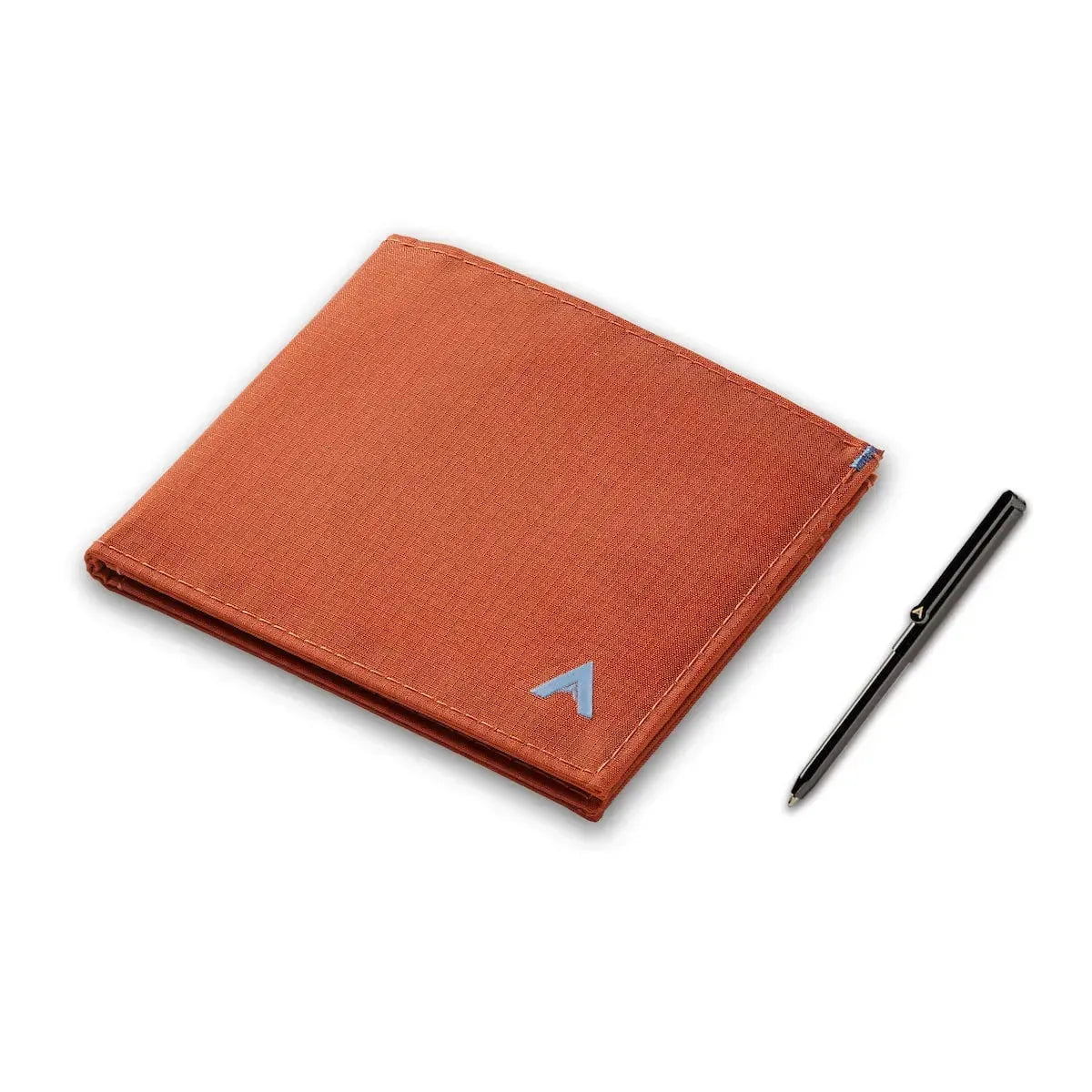 Potters clay RFID ID wallet made with vegan minimalist nylon next to a micro pen from Allett -Allett ID Wallet Nylon RFID potters-clay pen