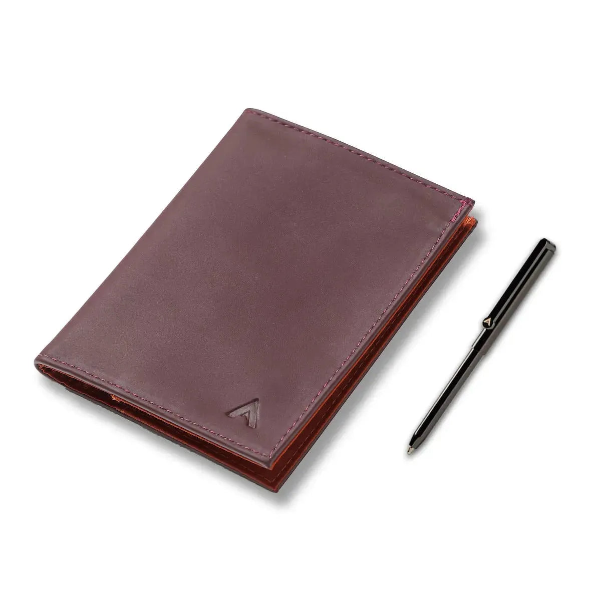 Allett's original design 4 card pocket leather wallet in merlot color next to a micro pen for both scale and because it can be purchased with the pen. Allett Leather Original Wallet merlot pen