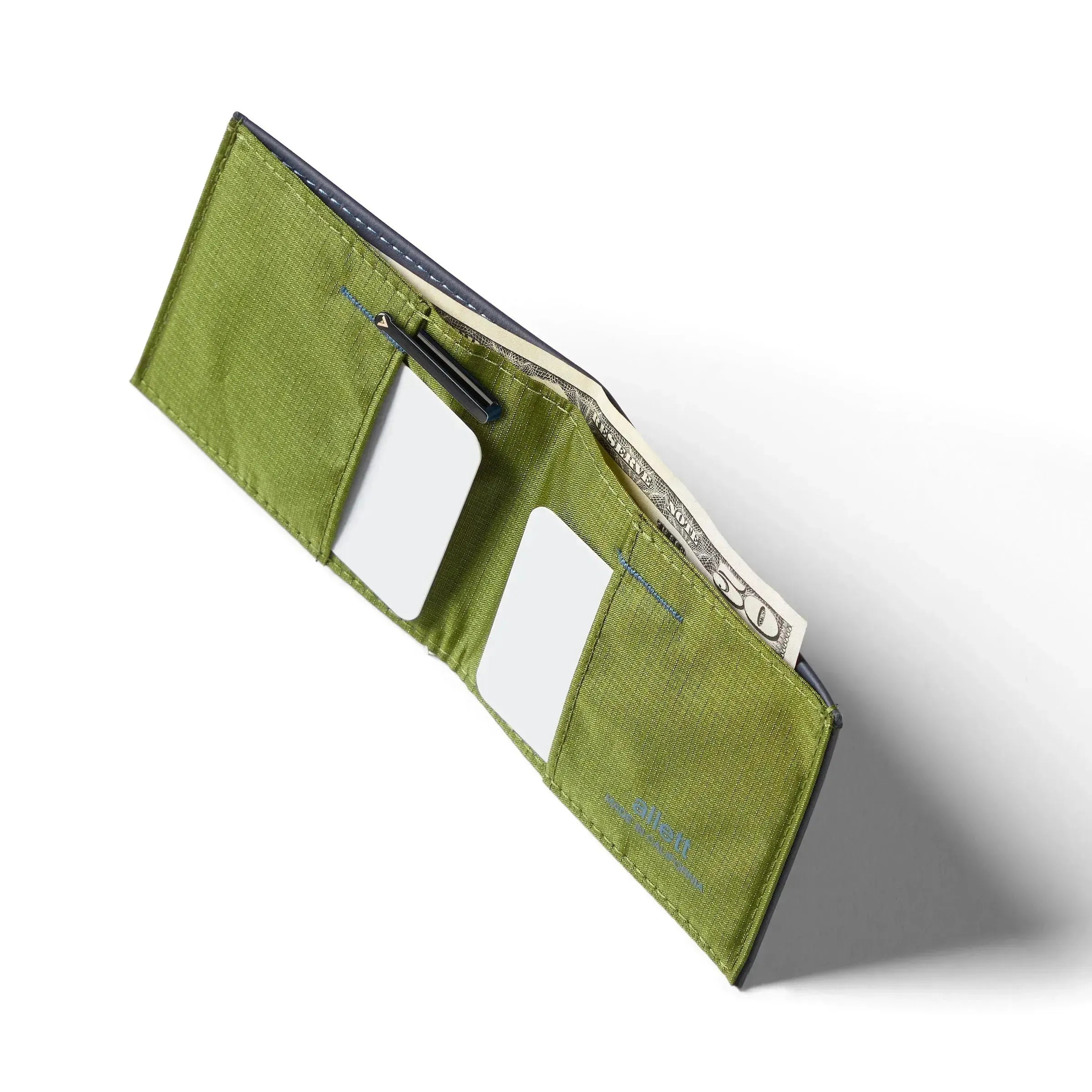 Bird's-eye view of the Nappa leather sports wallet featuring RFID blocking technology, open to reveal a cash pocket and card slots on either side. Allett leather sport wallet midnight-blue