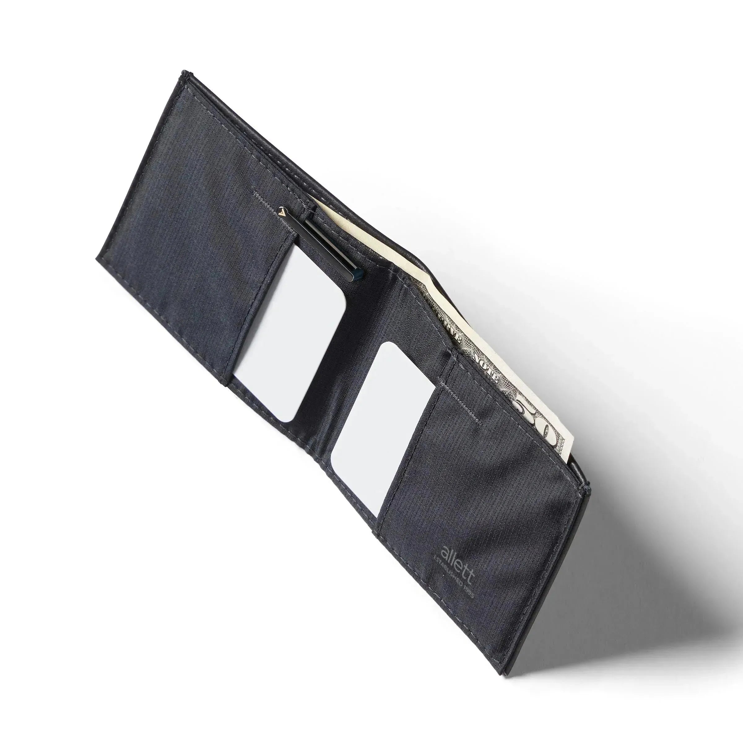 Aerial perspective of the opened Nappa leather RFID sports wallet, exhibiting a central cash pocket flanked by card slots. Allett leather sport wallet onyx-black