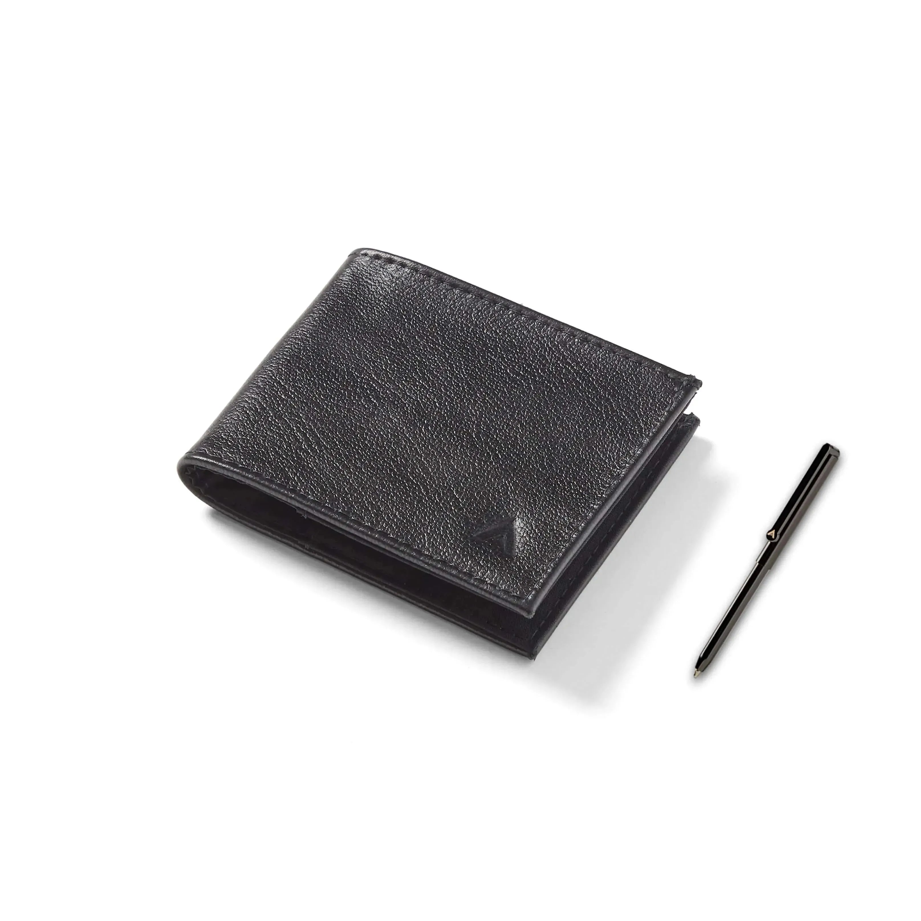 Allett's closed sports wallet in onyx black, placed adjacent to a micro pen on a whitewashed table. Allett Leather Sport Wallet onyx-black pen