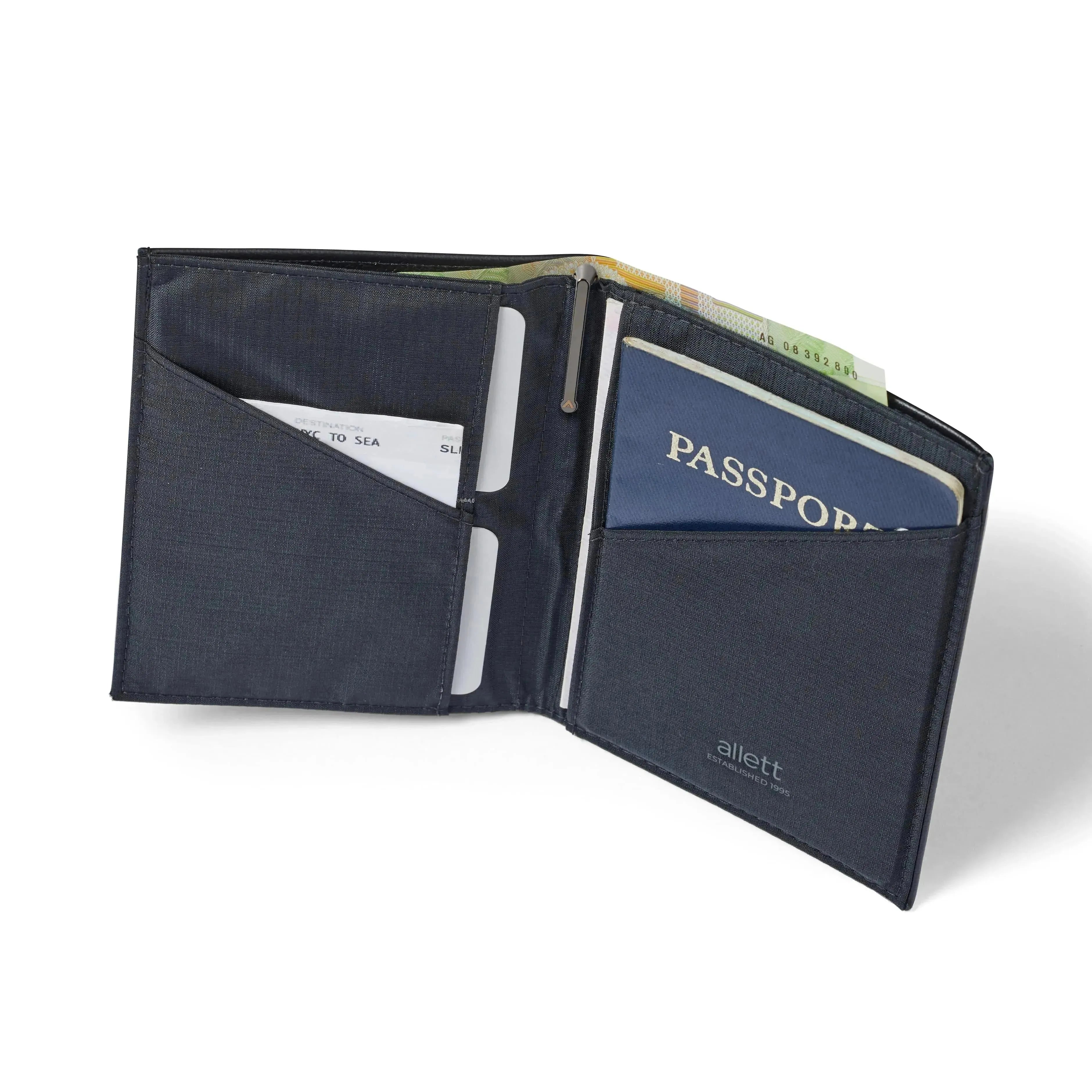 Upright open onyx black Nappa leather travel wallet from Allett, with a passport fitting snugly on the right, cards and a flight ticket on the left, and foreign currency protruding from the nylon-lined upper cash pouch. Slim Leather Travel Wallet by Allett for passport - onyx-black