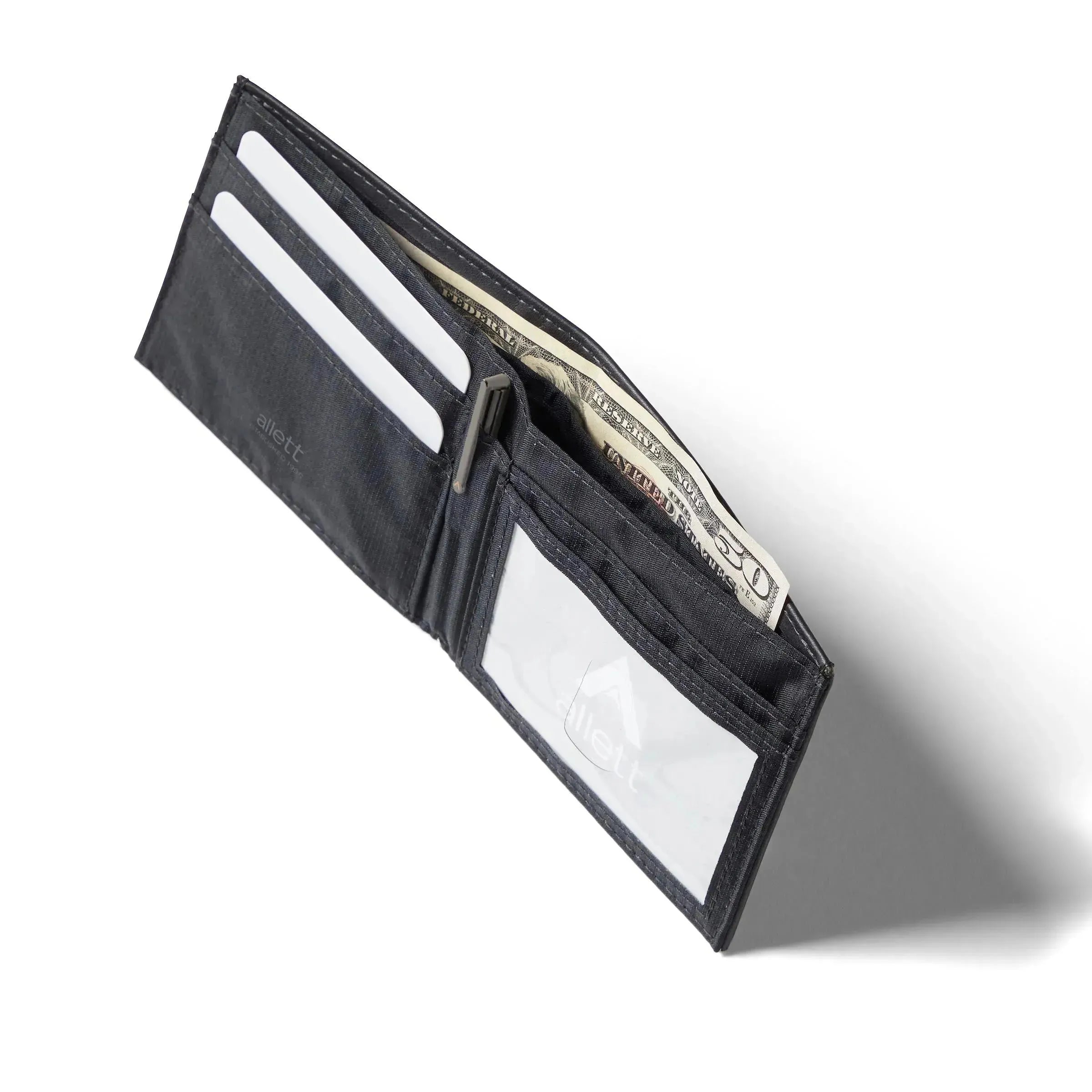 Open side view of the Onyx Black leather ID wallet from Allett Wallets with a shadow to show it's slim build. Allett id wallet leather onyx-black