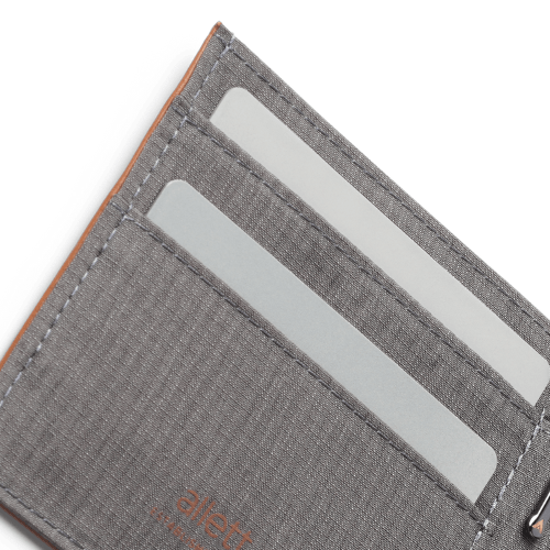 Gray fabric wallet with card slots on a white background