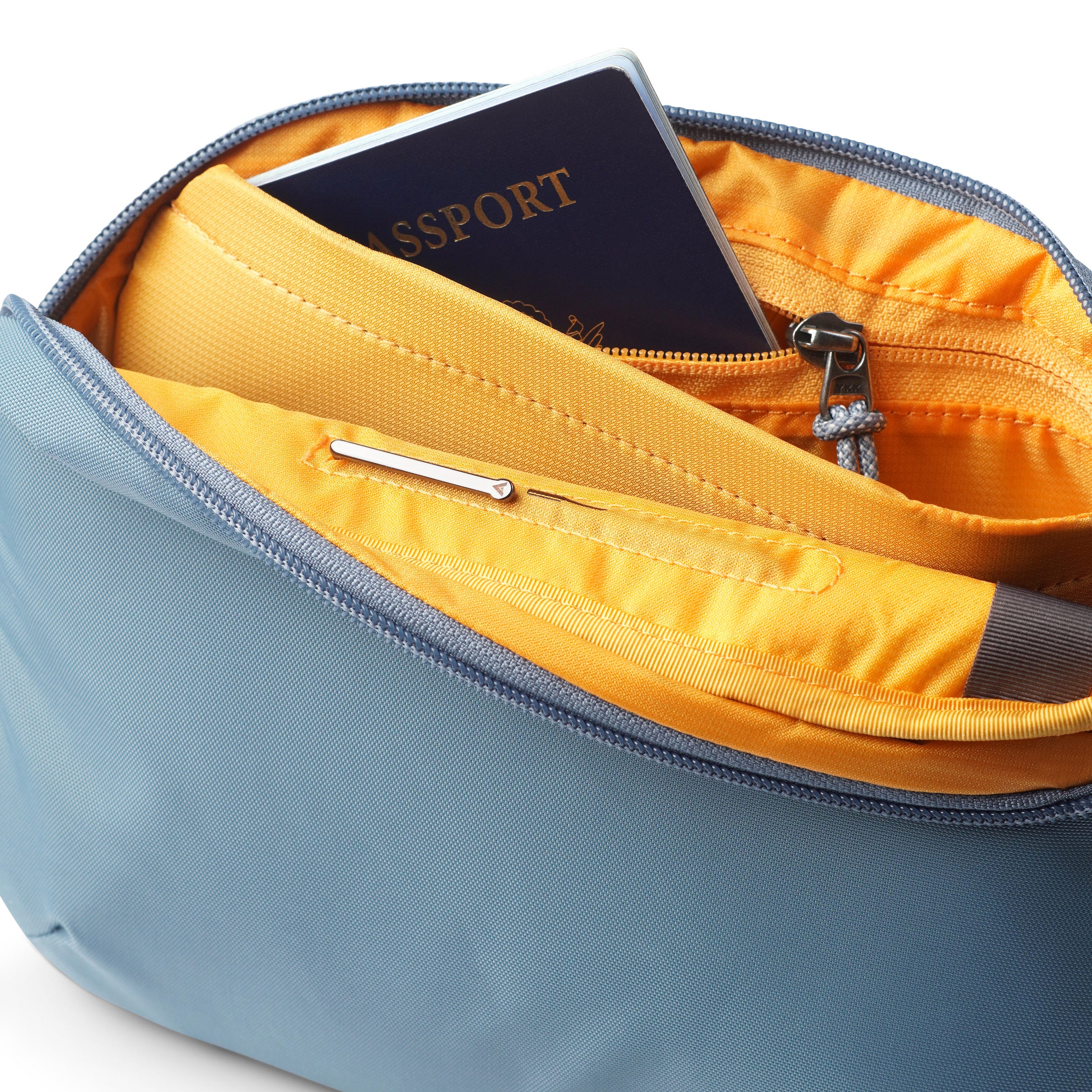 Allett Crossbody Sling Bag blue-haze interior pocket with passport