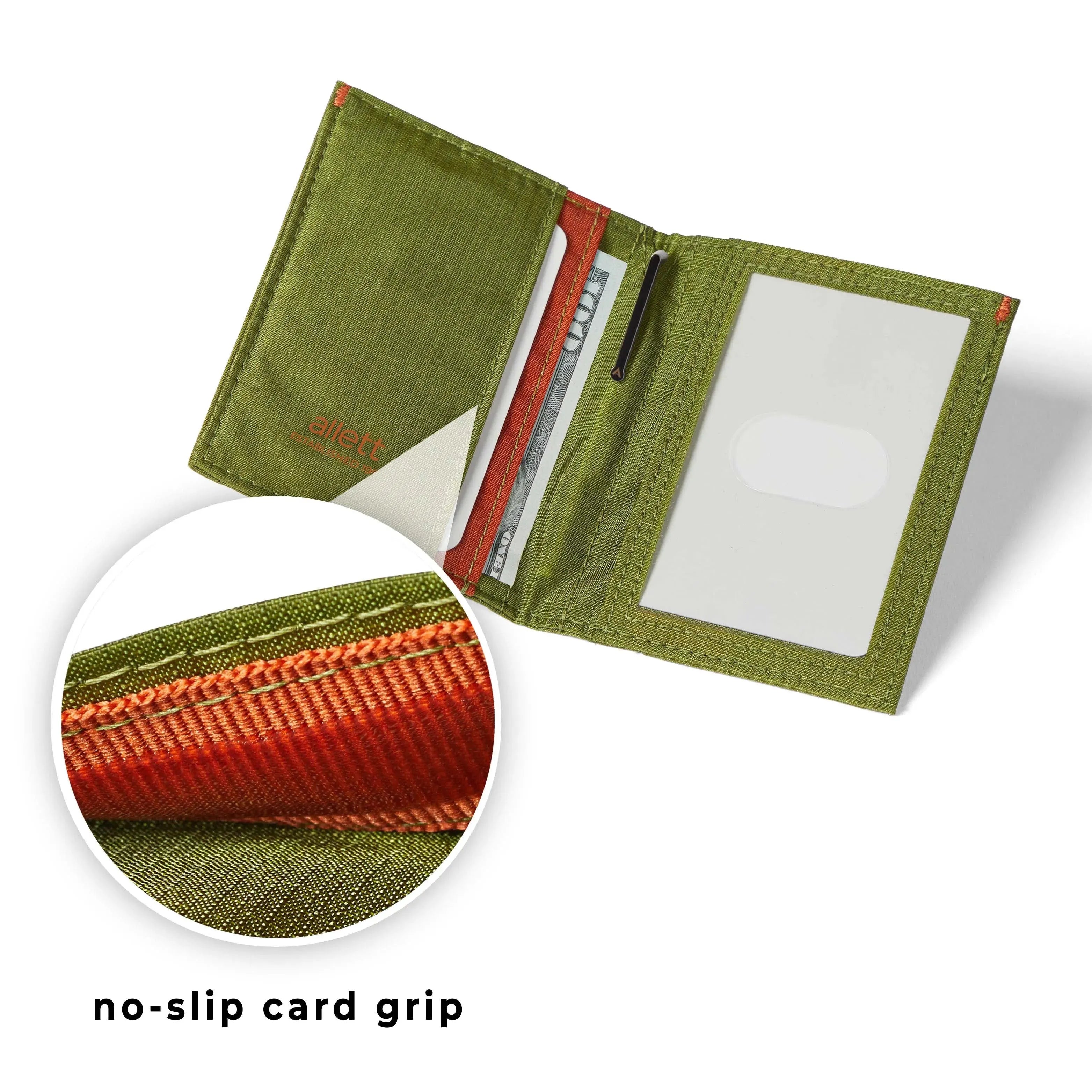 Extreme close up view of the orange nylon interior of the Cala Green hybrid wallet, exhibiting the 'no slip grip' feature that retains cards securely. Allett Hybrid Card Wallet cala-green