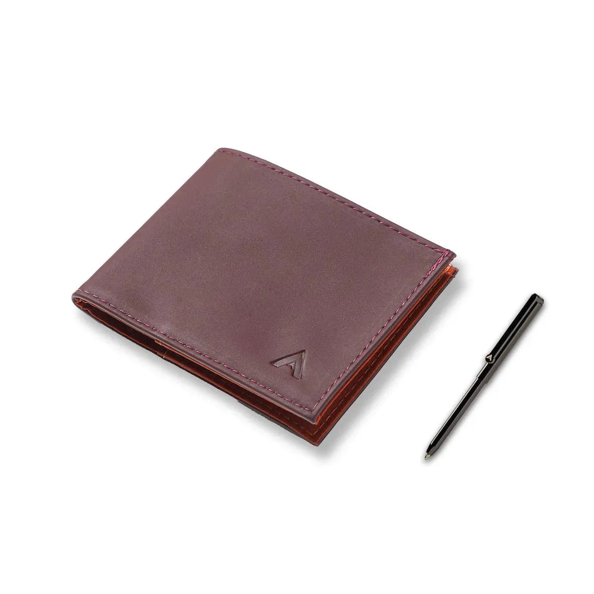 Closed merlot color wallet with a micro pen next to it on a white table. Allett Leather Sport Wallet merlot pen
