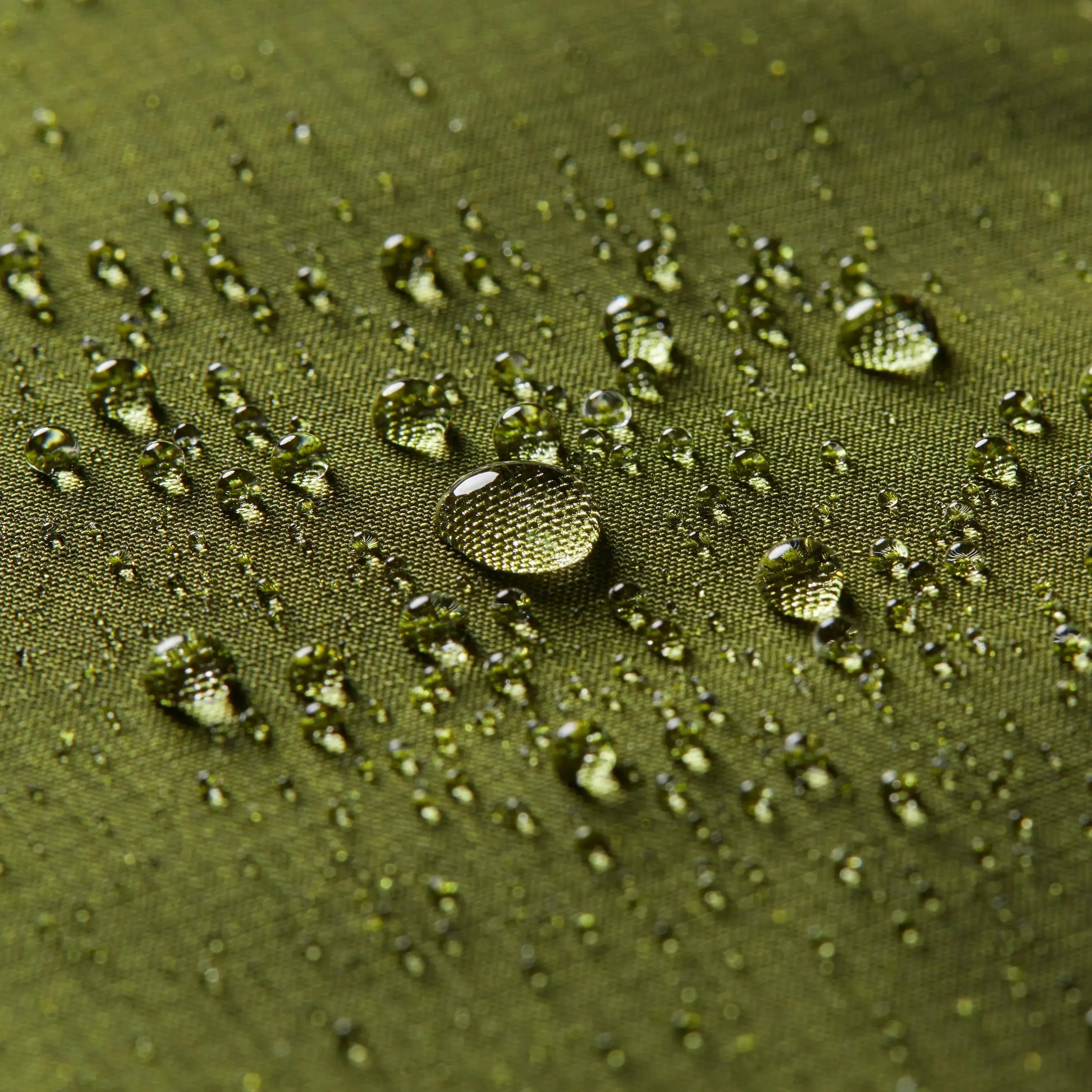 Detail shot of the Allett logo within the midnight blue Nappa leather sports wallet, accompanied by water droplets to hint at its water-resistant quality. Allett leather sport wallet midnight-blue