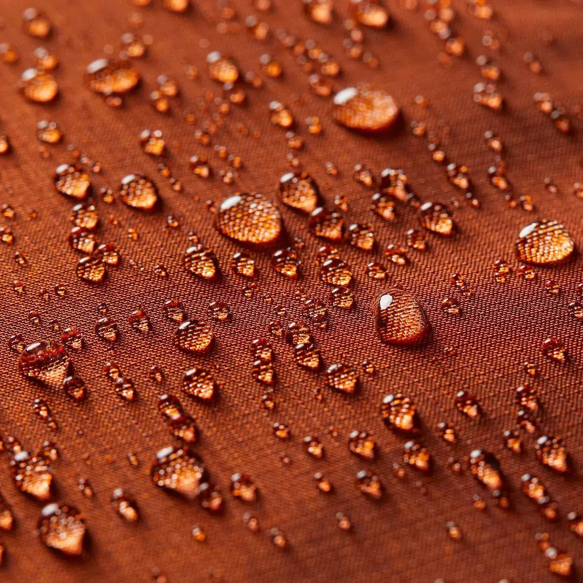 Close up of the interior of a merlot leather wallet with the Allett logo showing, surrounded by small water droplets. Allett id wallet leather merlot