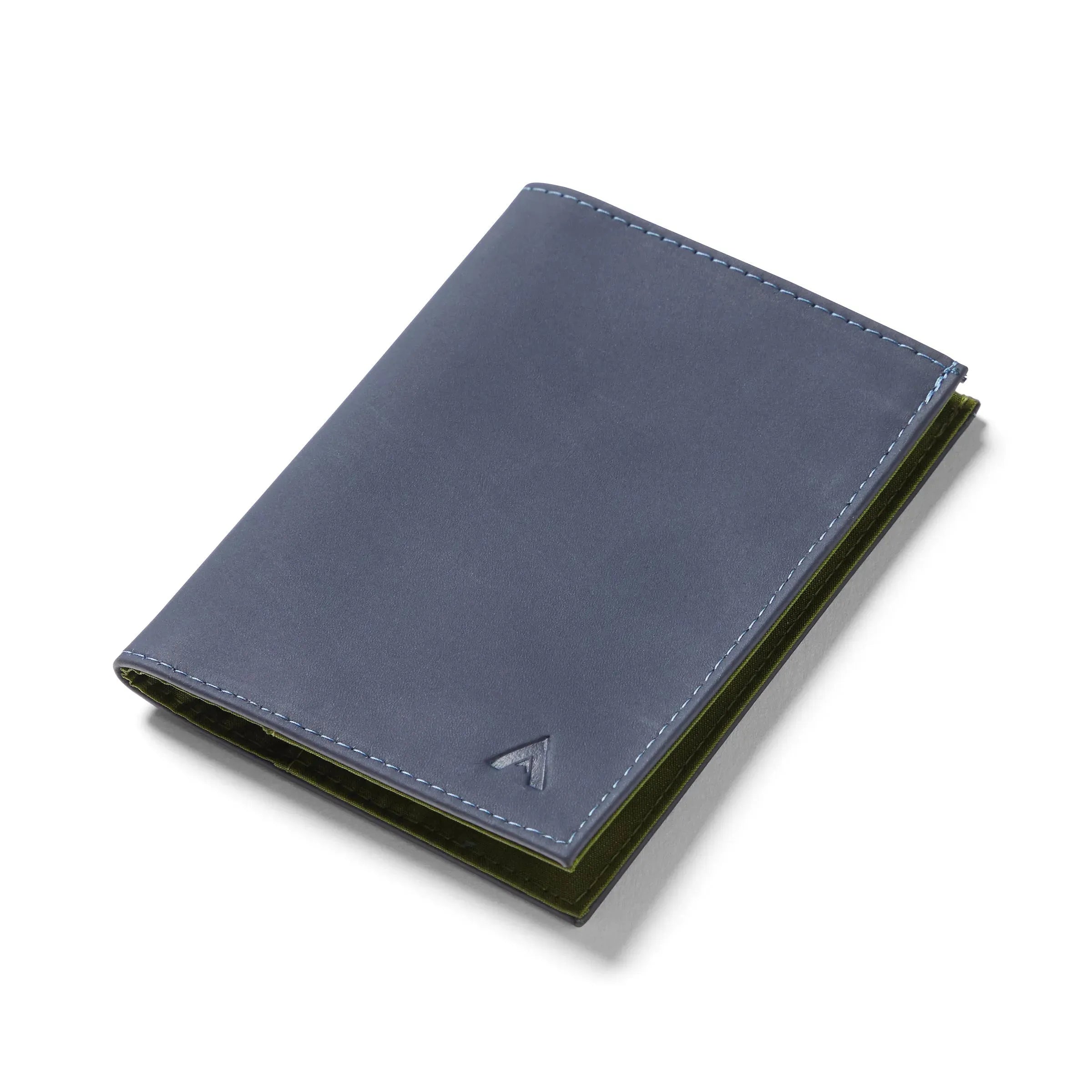 Midnight blue ultra thin leather wallet sitting closed against a white background. Allett leather original wallet midnight-blue