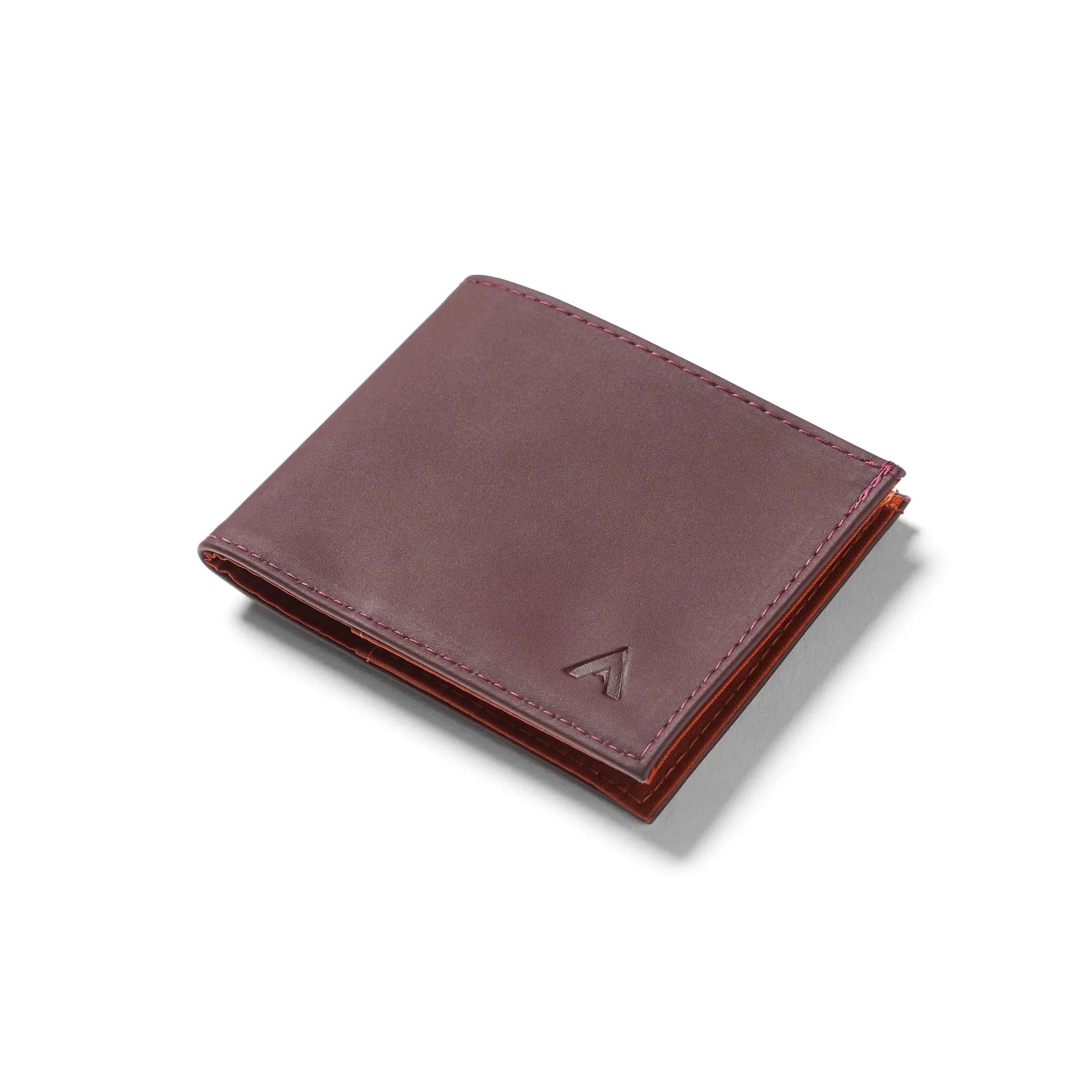 Closed Allett leather sports wallet in merlor color against a white background. Allett leather sport wallet merlot