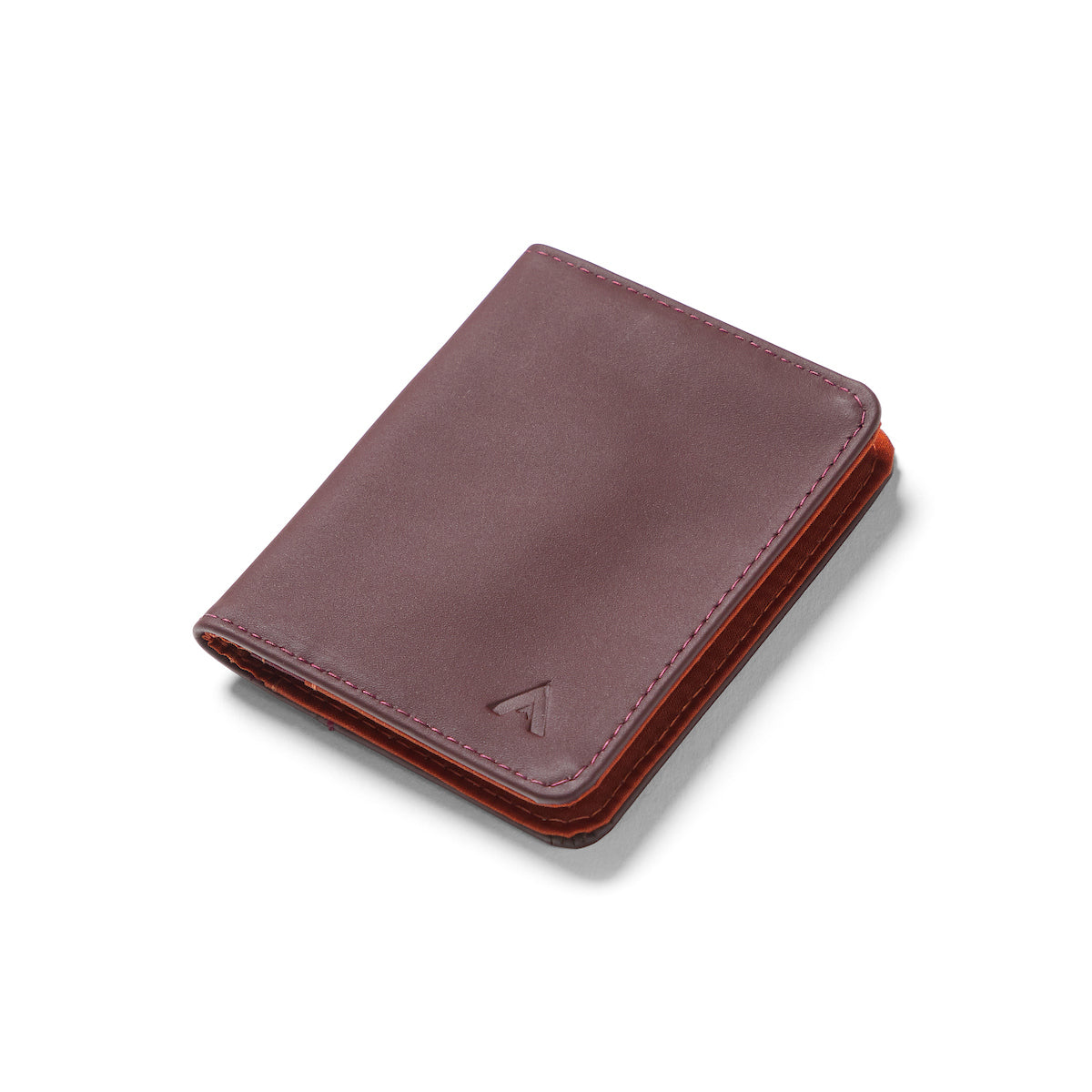 Closed merlot Nappa leather RFID hybrid card wallet against a white background. merlot