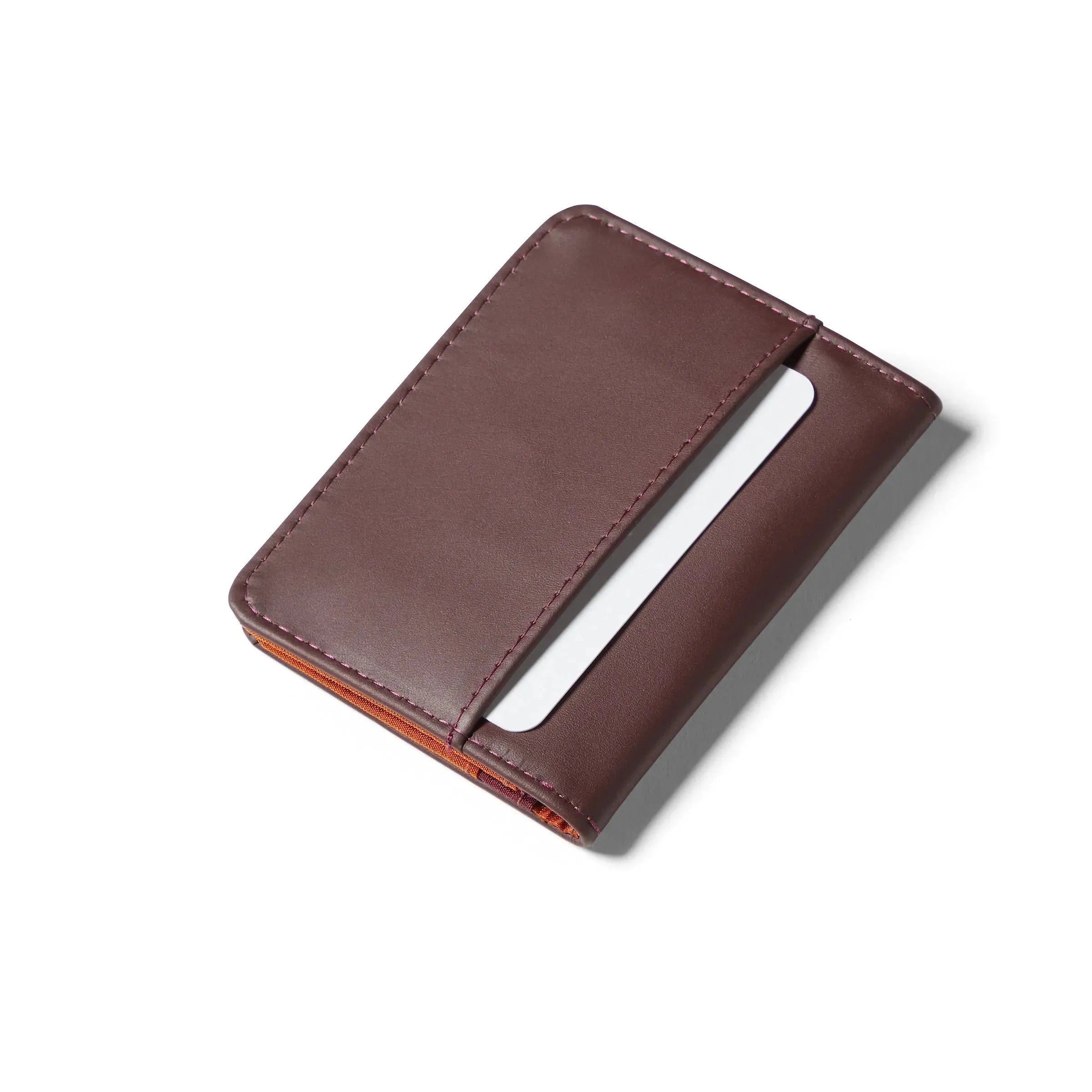 Closed merlot leather hybrid card wallet on a white background showing the exterior pocket of the wallet. merlot