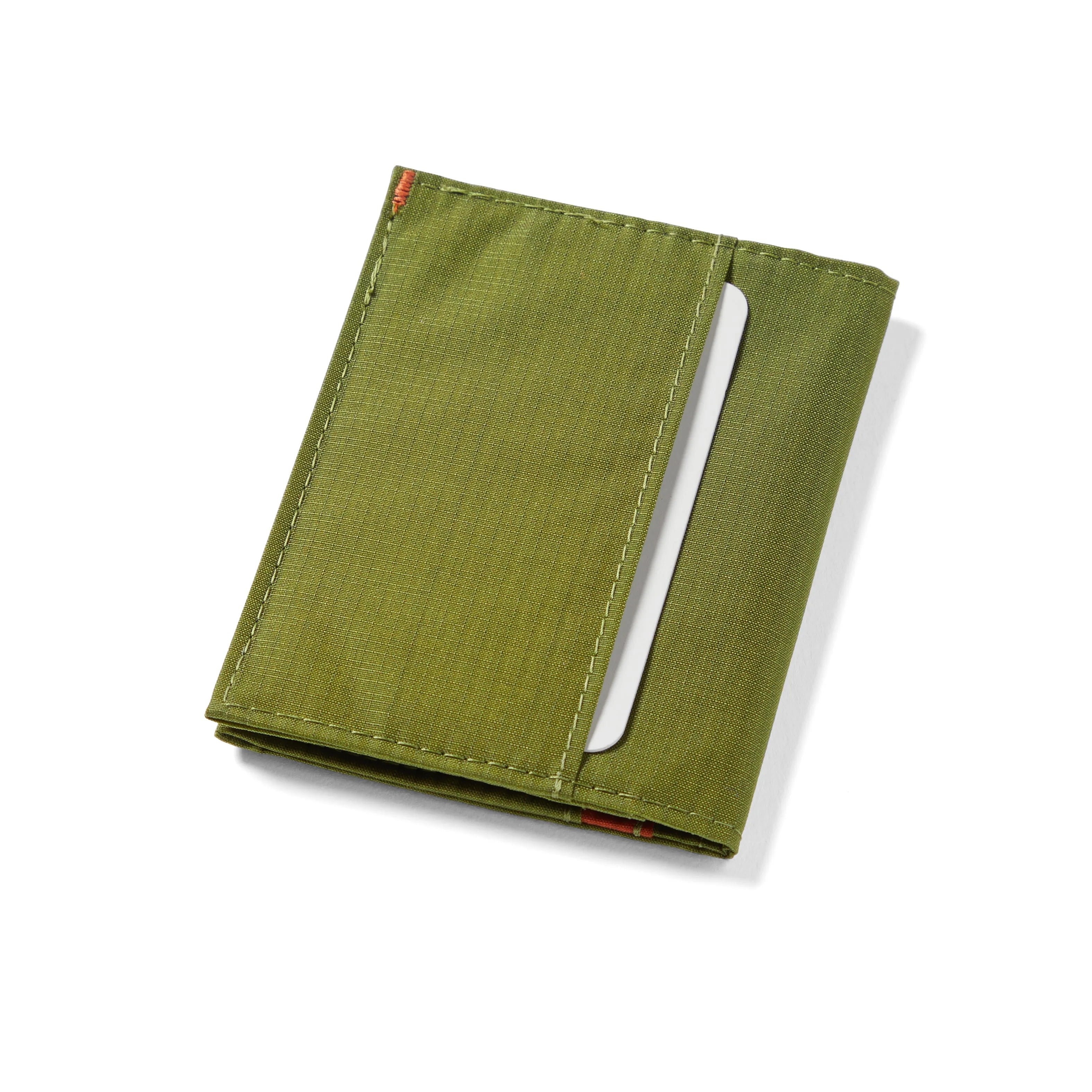Exterior pocket view of the Cala Green hybrid card wallet, capable of storing cards and folded bills. Allett Hybrid Card Wallet cala-green