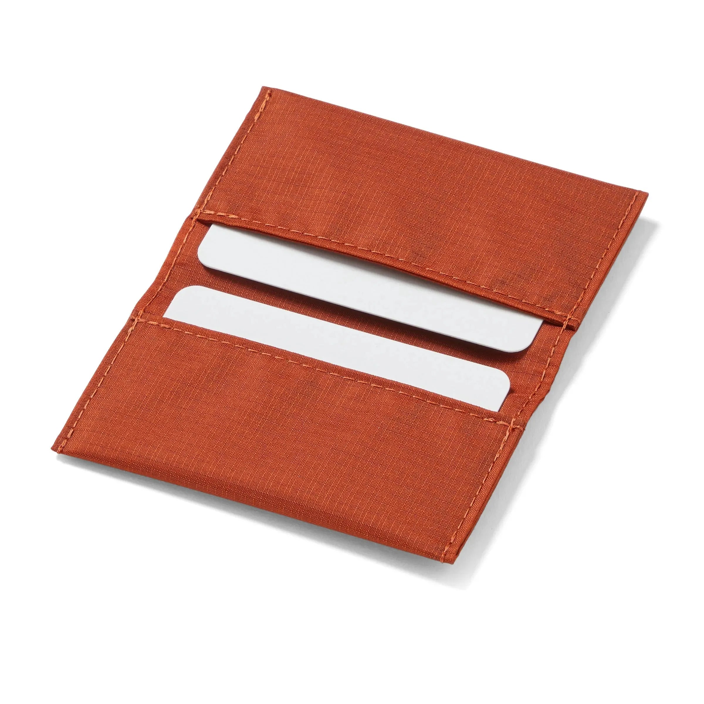 Open display of Allett's vegan potters clay card wallet, made of rip-proof nylon, spotlighting its slimness. - potters-clay