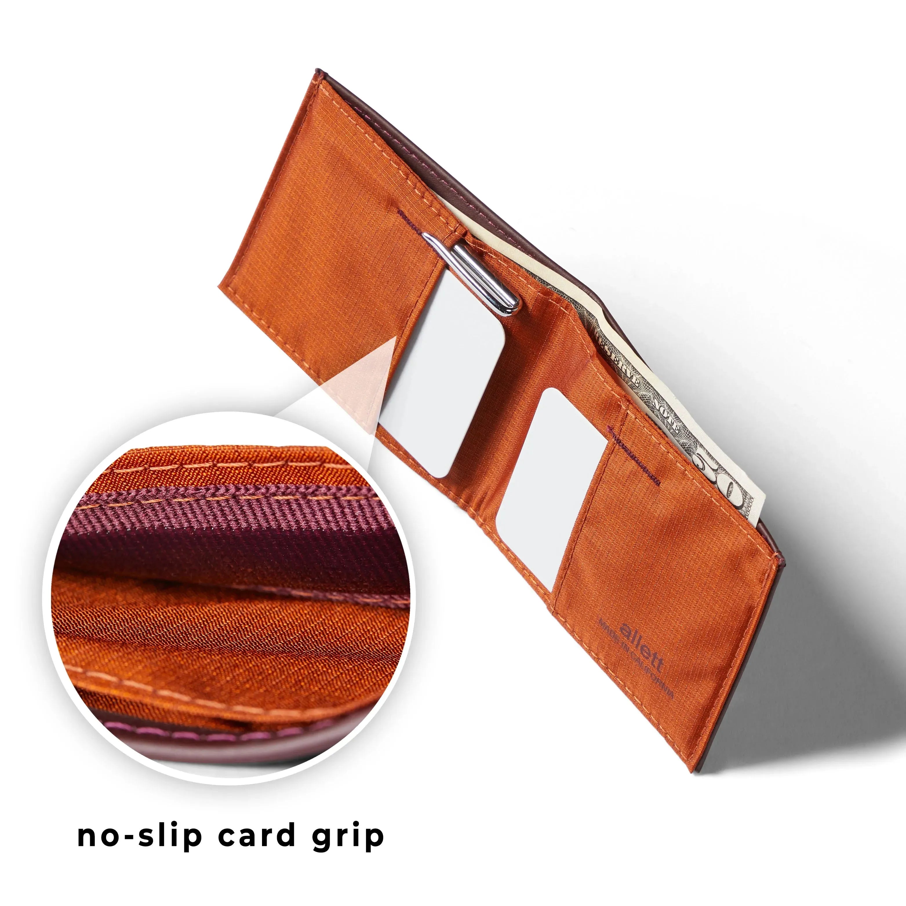 Upwards view of leather sports wallet from Allett with a section of the wallet magnified to show the slip preventing grip. Allett Leather Sport Wallet merlot