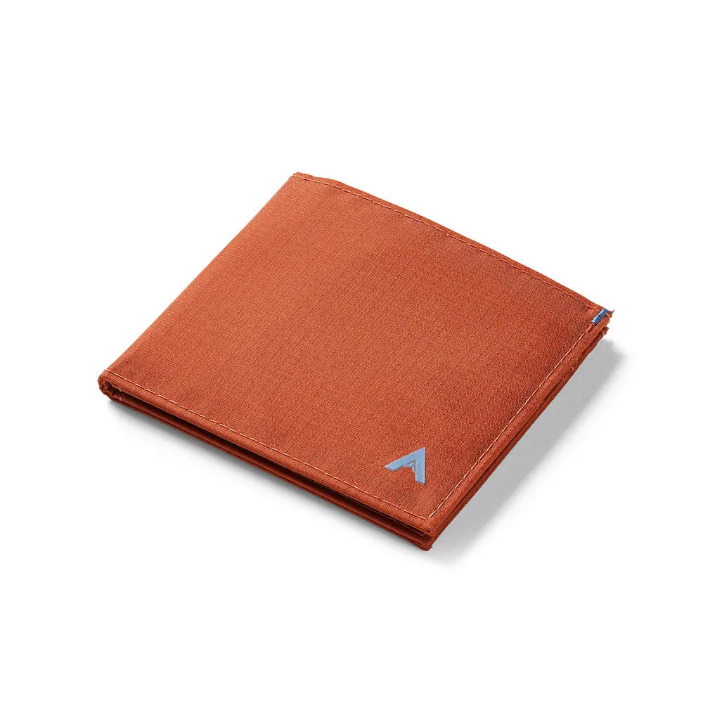 Unique potter's clay ID wallet closed on a table -Allett ID Wallet Nylon RFID potters-clay