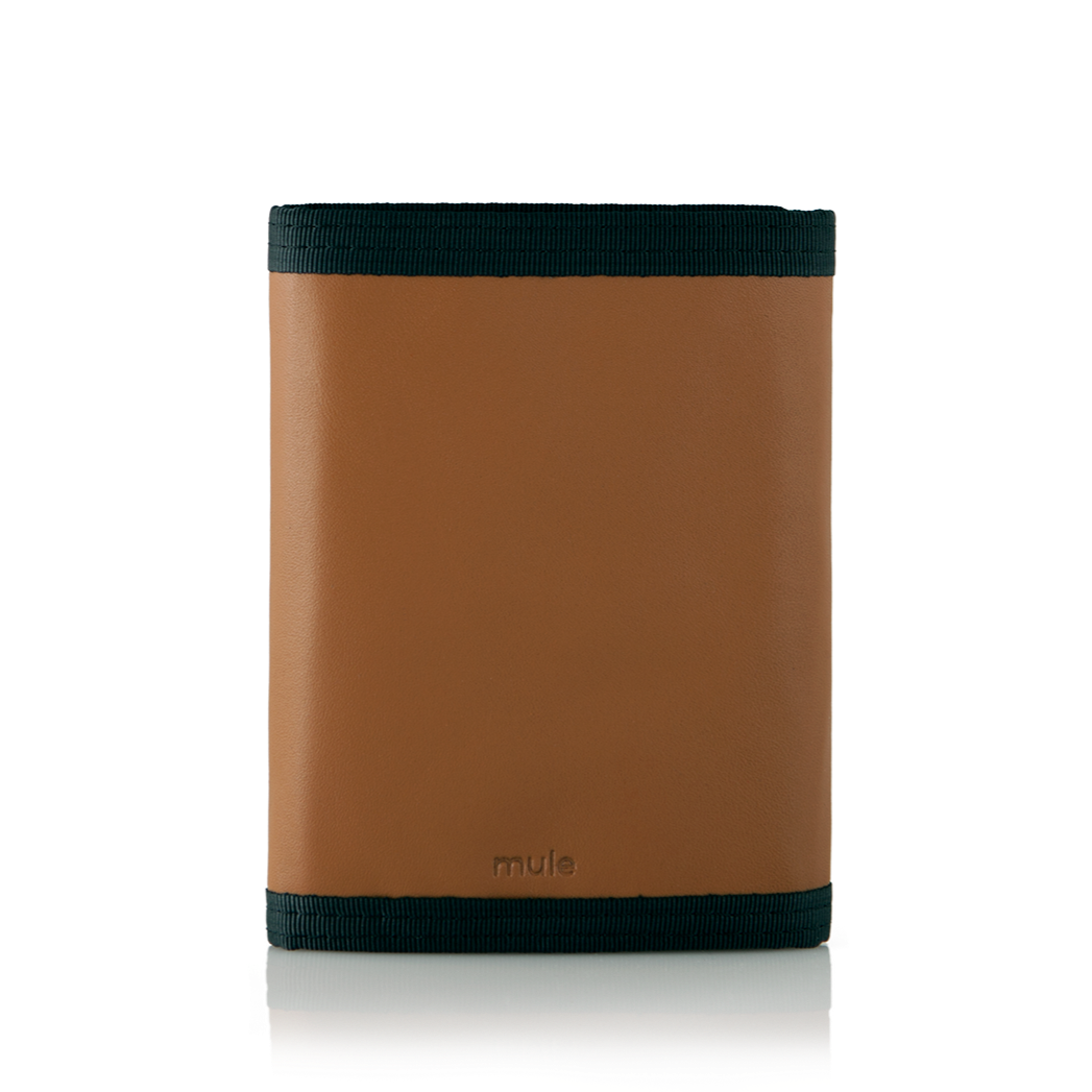 Rear perspective of the brown leather "Switchback" trifold wallet with trim, securely closed, against a contrasting white backdrop. Allett Switchback Leather Wallet - brown
