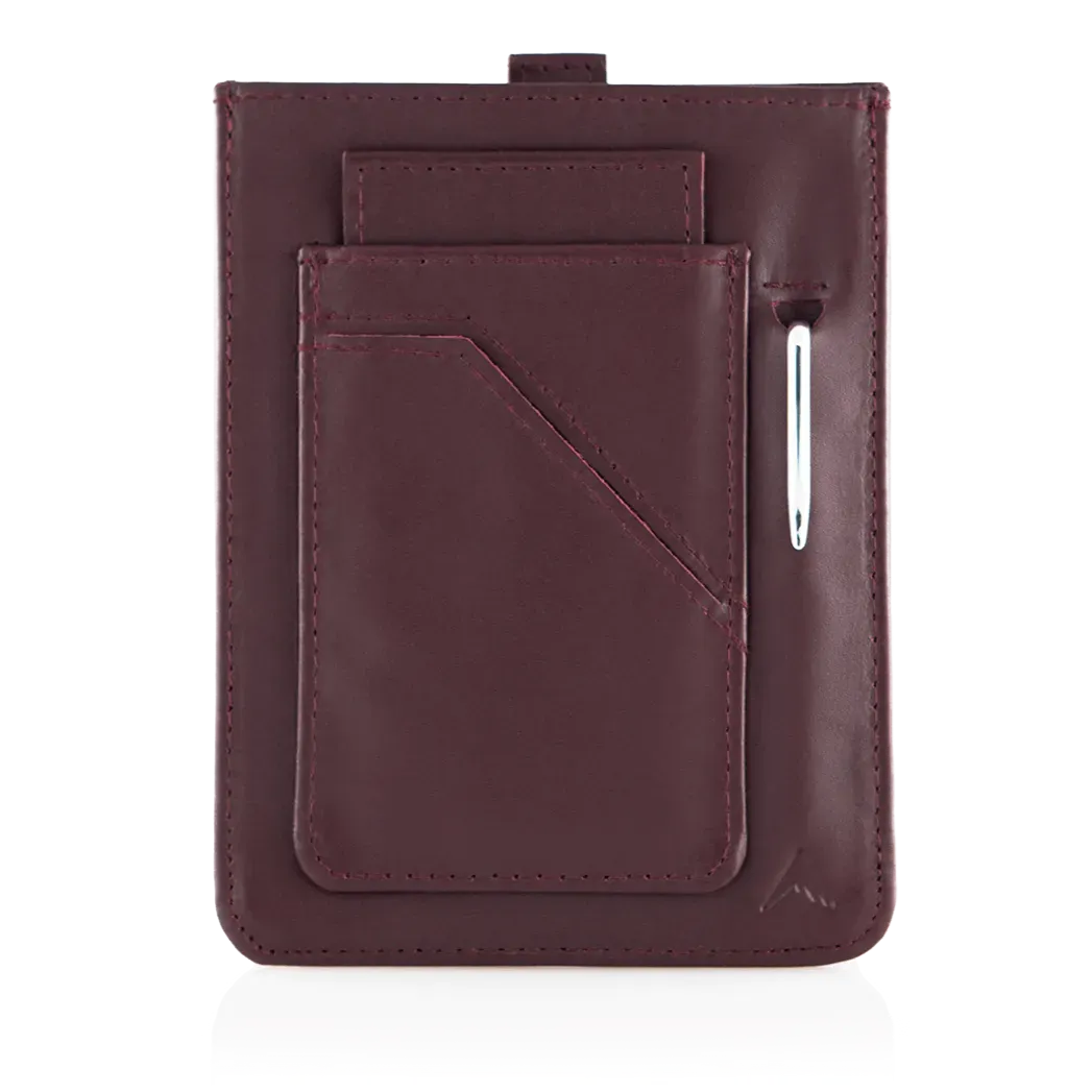 Empty back of the oxblood colored premium ultra thin leather wayfinder wallet with a visible pen sticking out of the micro pen pocket. Allett Wayfinder Leather Wallet - oxblood