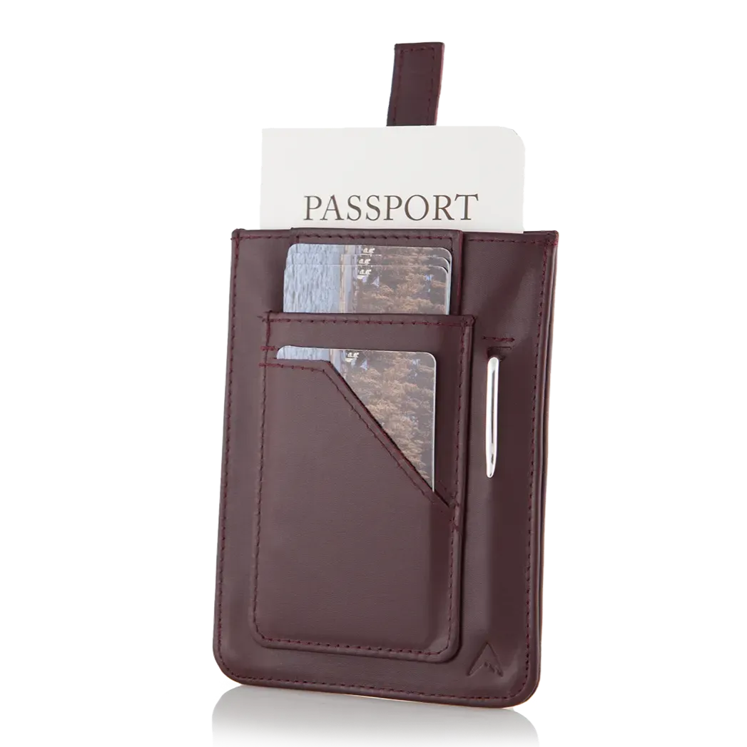 Oxblood-colored wayfinder leather wallet by Allett, showcasing a unique pull-tab design for card access and integrated RFID protection. An exterior pocket provides visible storage for several cards. Allett Wayfinder Leather Wallet - oxblood