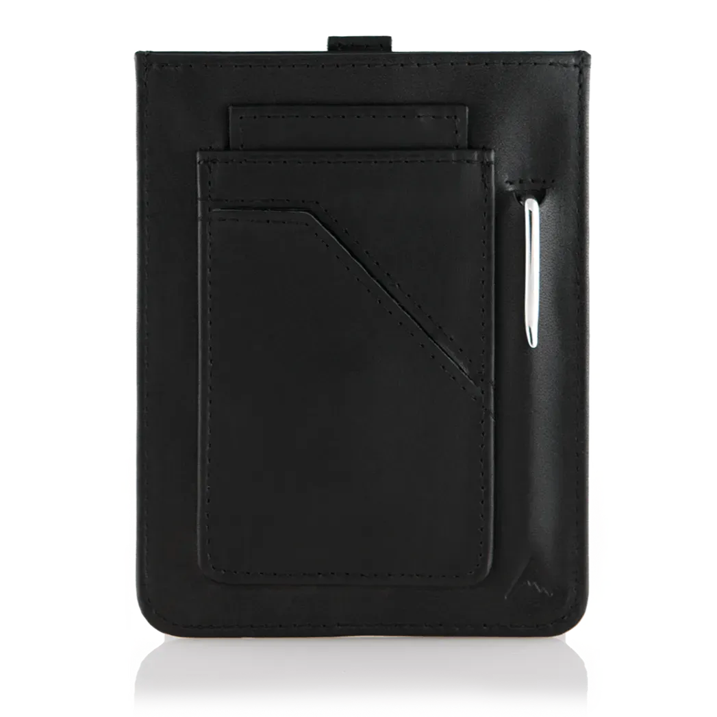The back of the empty black wayfinder wallet, fashioned in ultra-thin leather, featuring a pen protruding from the compact pen pocket. Allett Wayfinder Leather Wallet - black