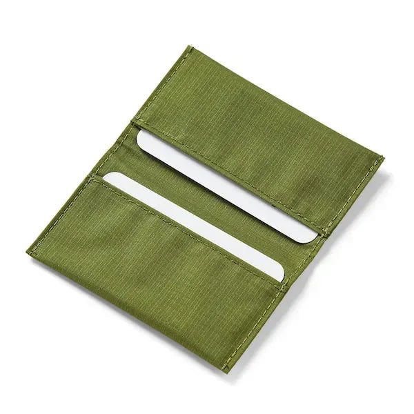 Open view of the ultra slim vegan card wallet in cala green made with rip resistant nylon from Allett. - cala-green