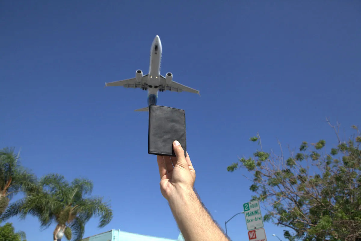 Travel Wallet With Plane in Background