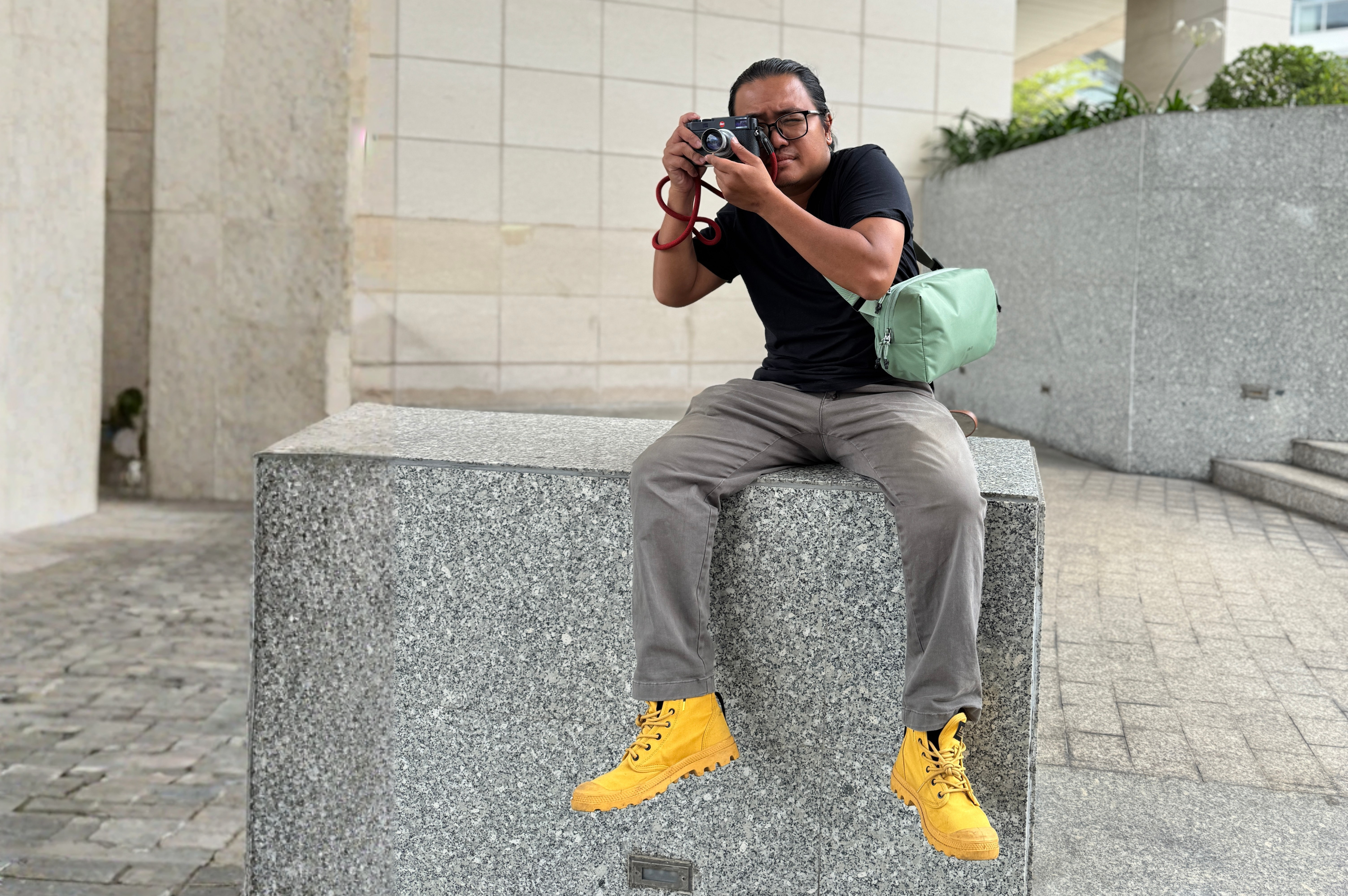 Allett Sling Bag on a guys shoulder taking a picture gifts for maximalists