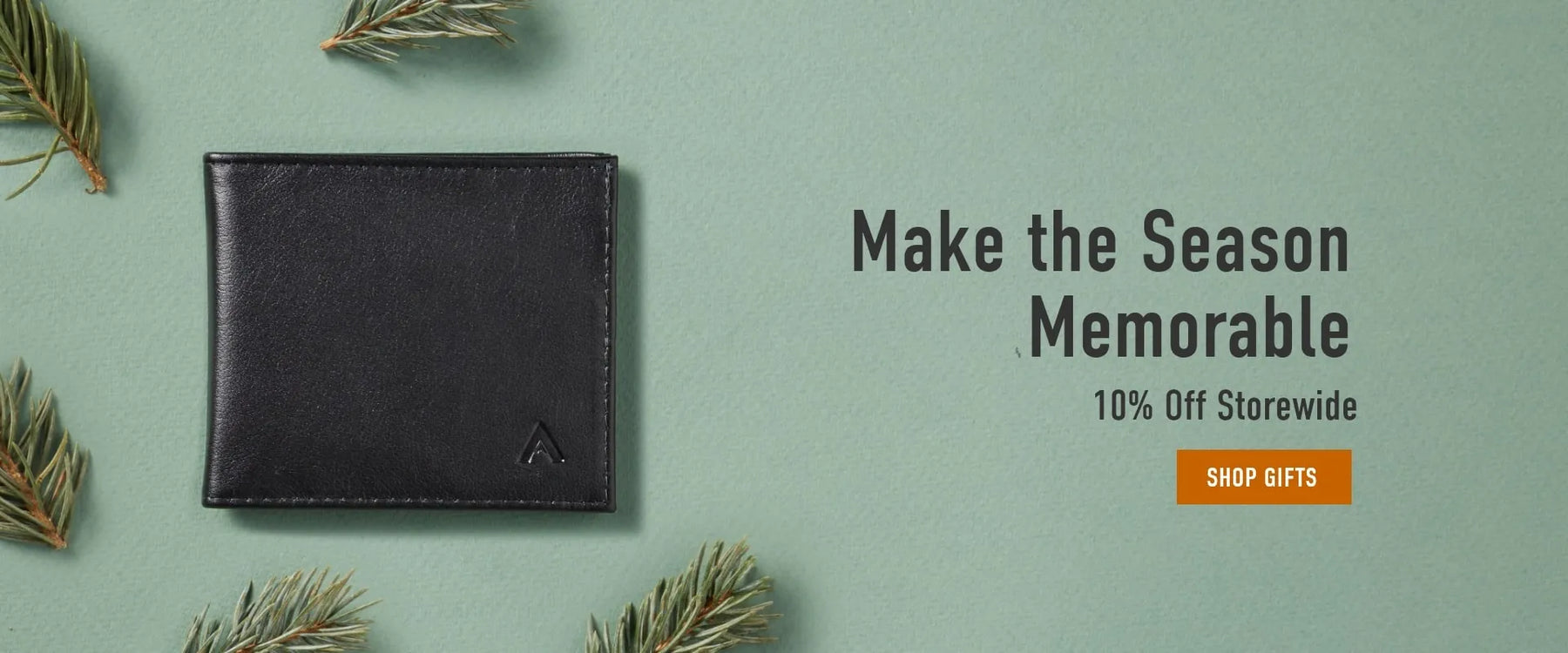 Slim Leather Wallet by Allett with green background and pines scattered around it. 