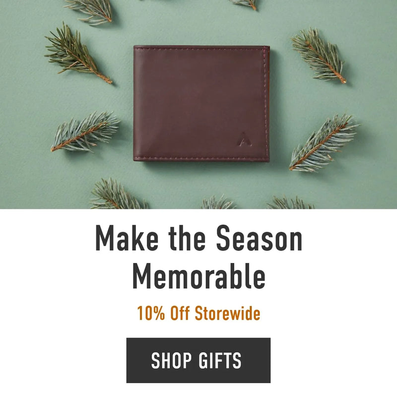 Slim Wallet by Allett on green background with pines scattered around 