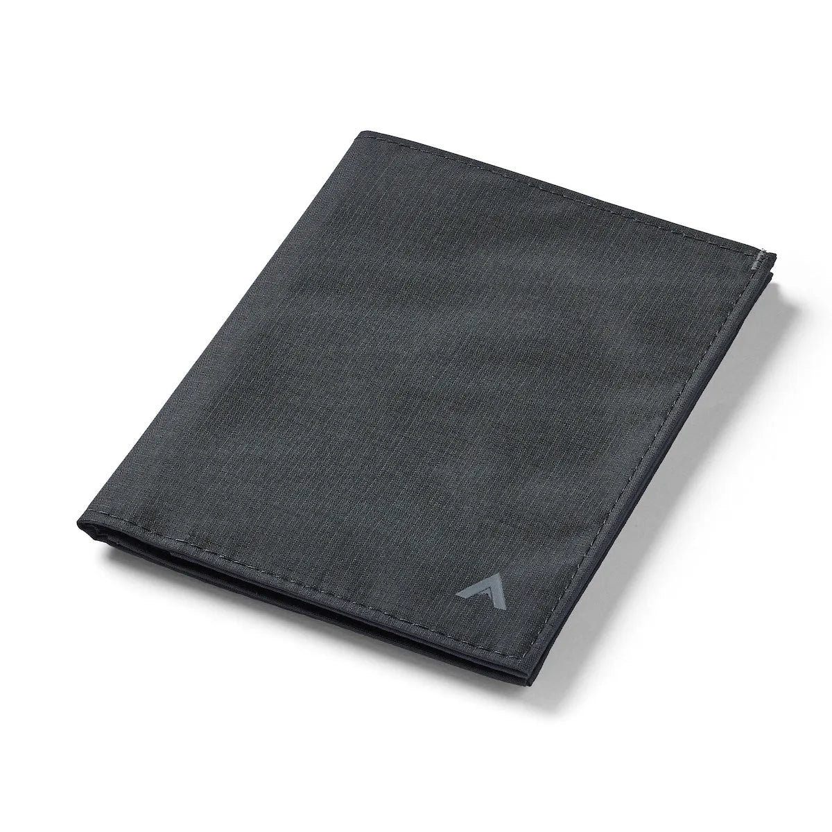 Allett's closed jet black ripstop nylon wallet, equipped with RFID protection, is displayed against a white backdrop, with the brand's emblem seen in the bottom right corner. Allett Travel Wallet RFID Nylon - jet-black