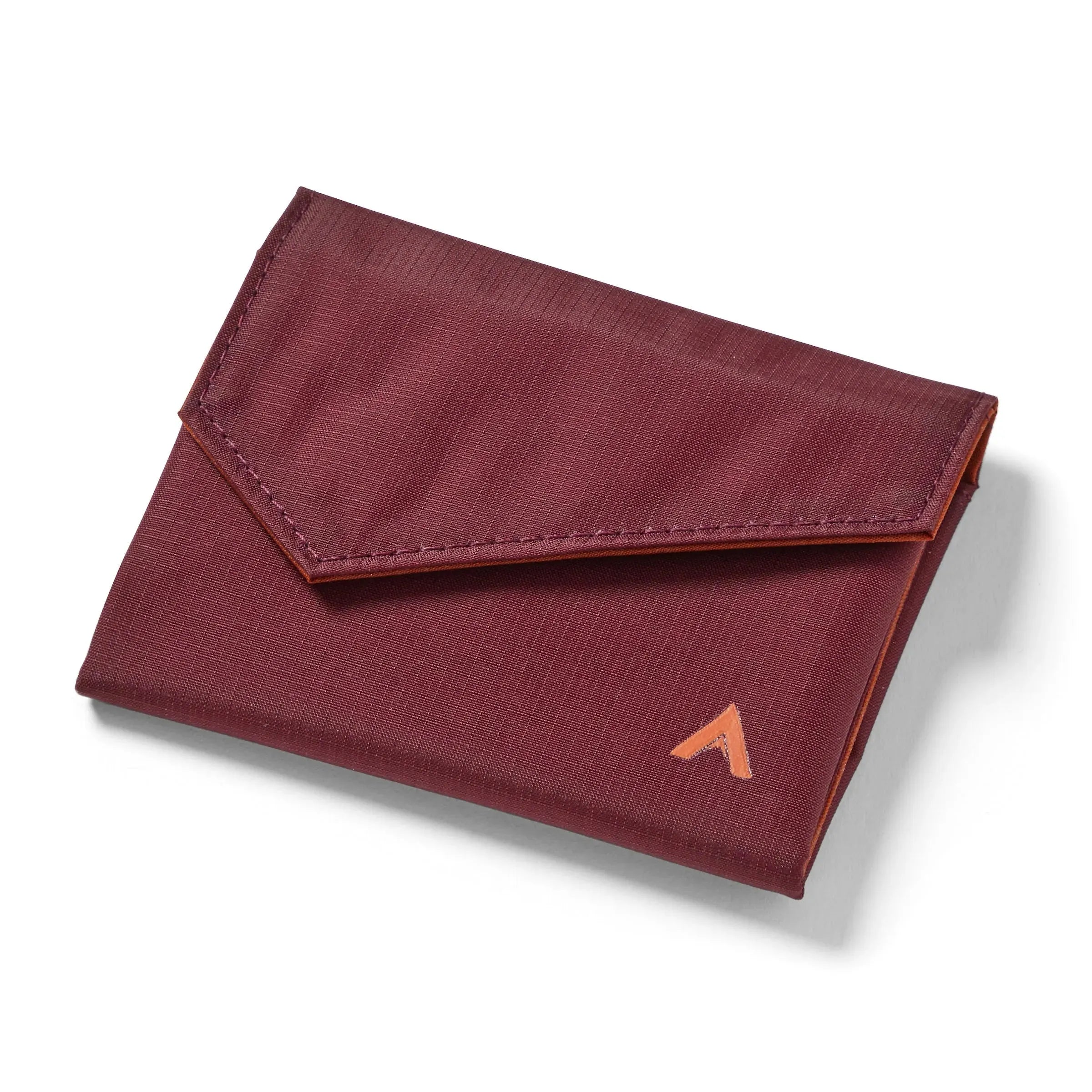 Closed merlot vegan nylon accordion wallet against a white background, the Allett logo visible on the bottom right, and an angled, slightly triangular flat in the front. Allett Accordion Wallet in RFID Blocking Nylon  mulberry