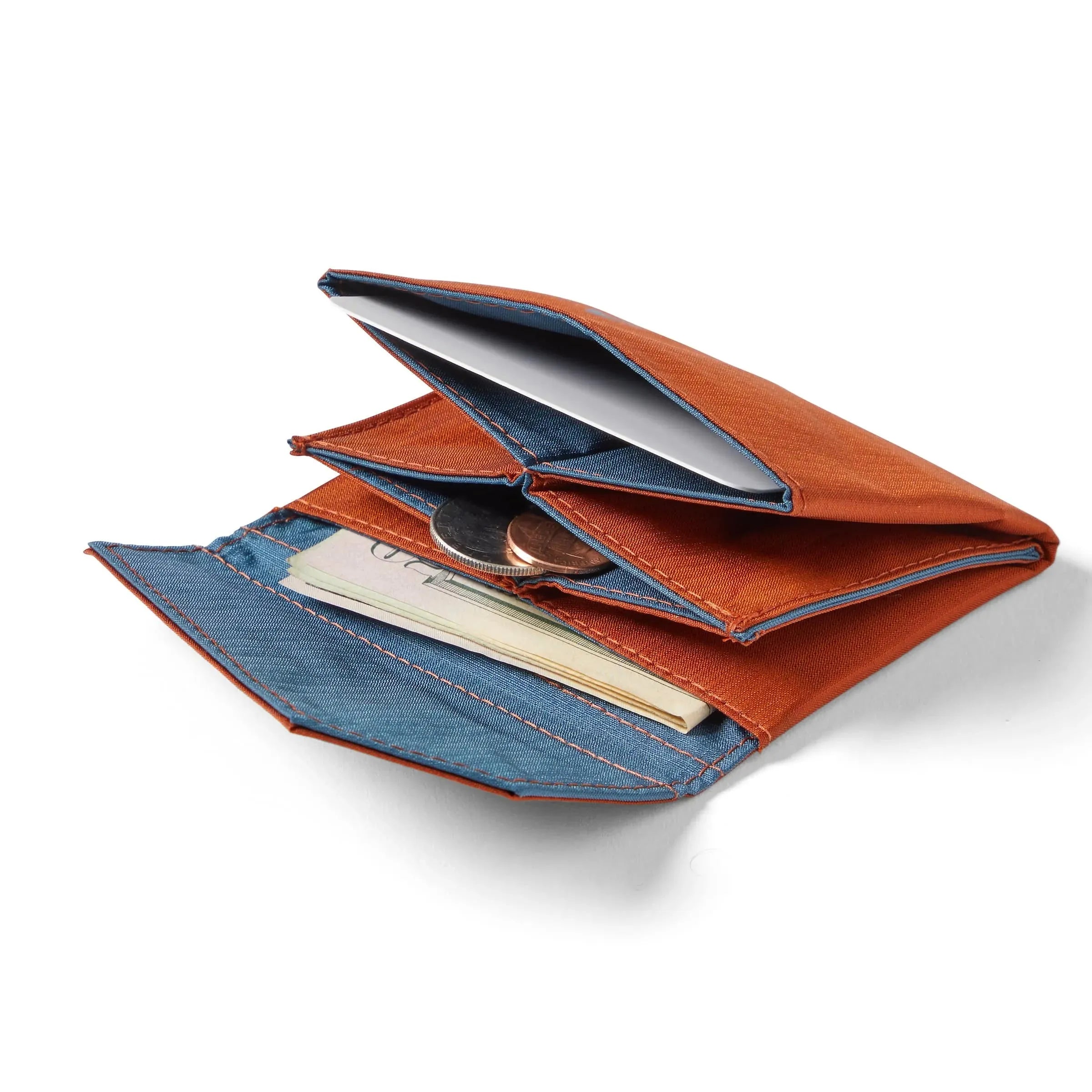 Premium potter's clay nylon accordion wallet from Allett, displayed open and flat on a white surface, with currency and coins slightly extending from the interior compartments. Allett Accordion Wallet in RFID Blocking Nylon potters-clay