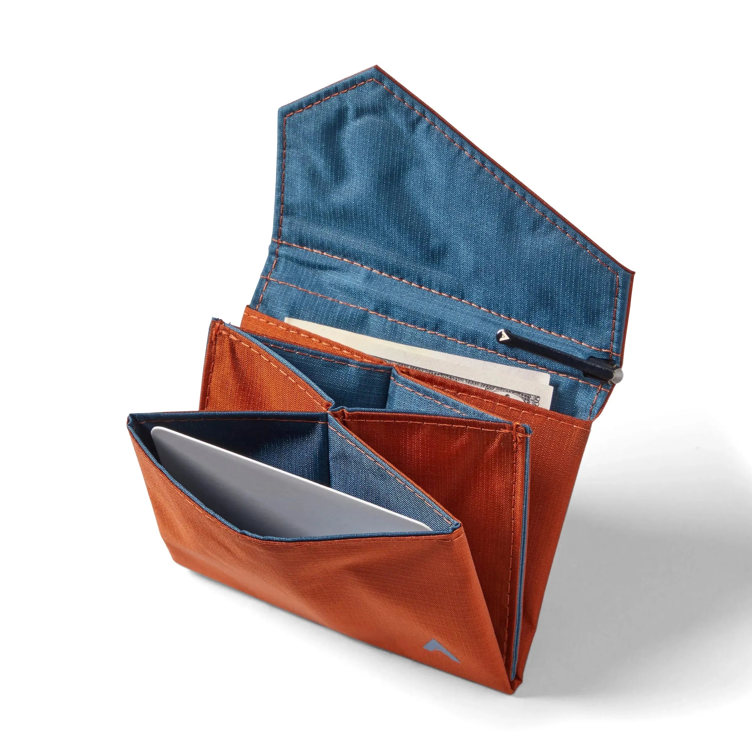 Allett's potter's clay nylon accordion wallet with the flap raised, revealing a blue interior, several pockets for credit cards and cash, along with a compartment inside the flap. Allett Accordion Wallet in RFID Blocking Nylon potters-clay