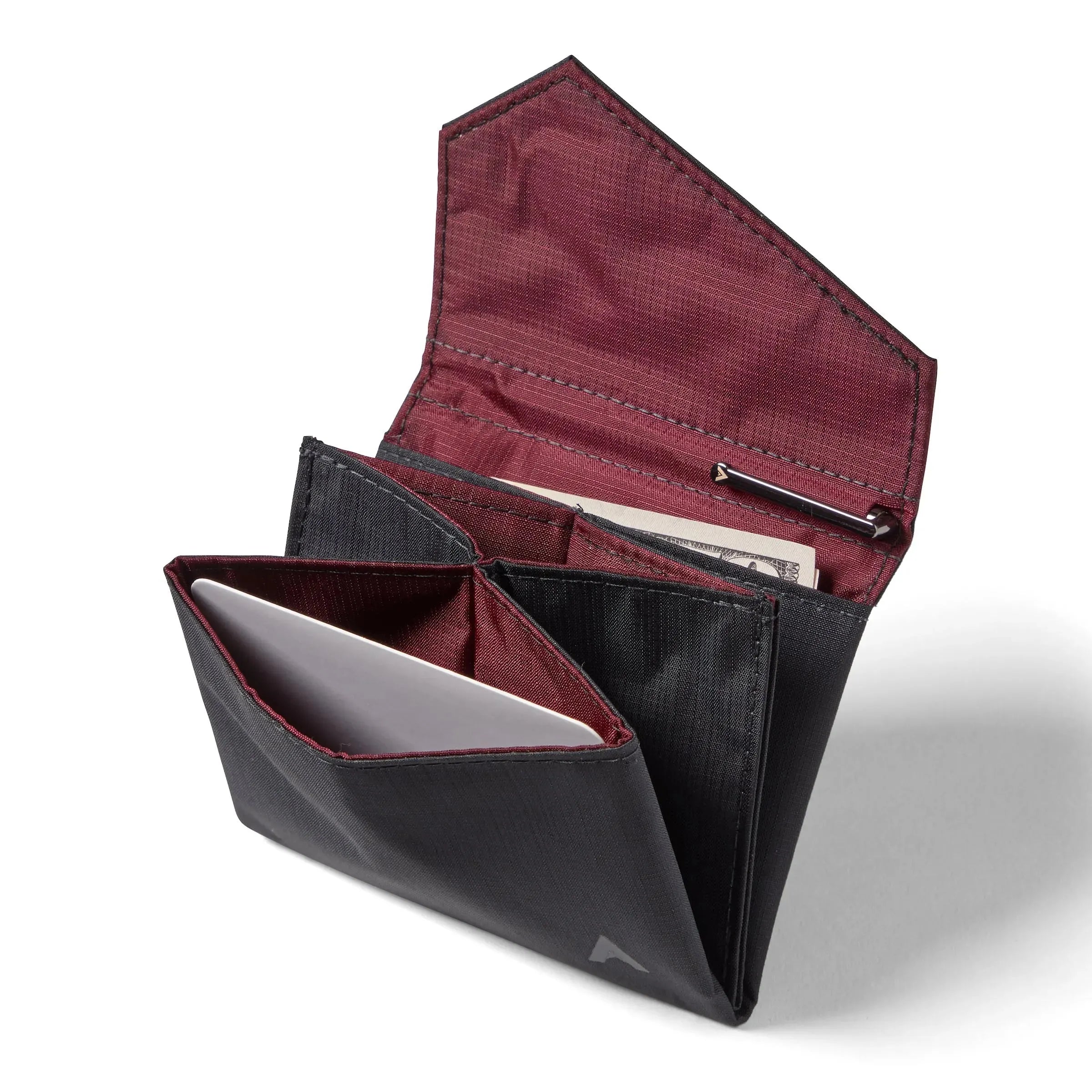 Open jet black nylon accordion wallet by Allett, with the flap opened to display multiple compartments for cards and money, and a special spot for a micro pen. Allett Accordion Wallet in RFID Blocking Nylon  jet-black