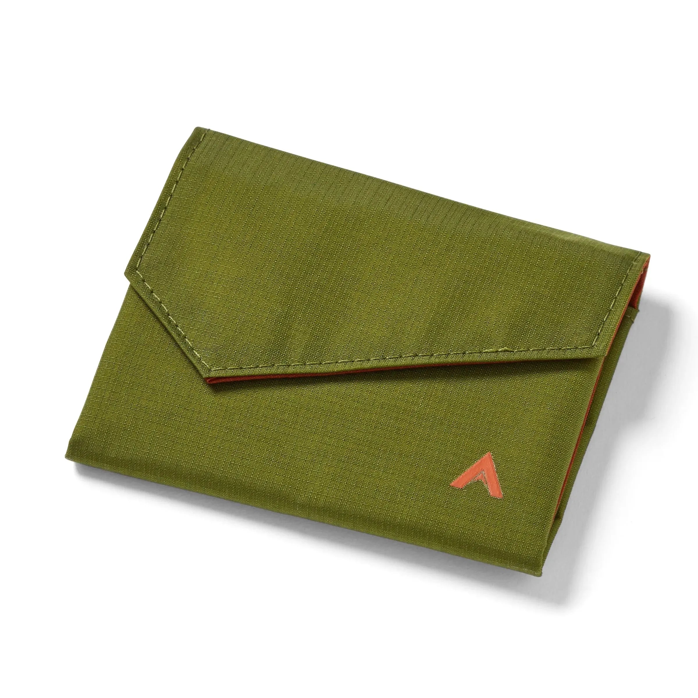 Allett's cala green nylon accordion wallet, closed against a white background, with a uniquely angled front flap, and the brand logo in the bottom right corner. Allett Accordion Wallet in RFID Blocking Nylon cala-green