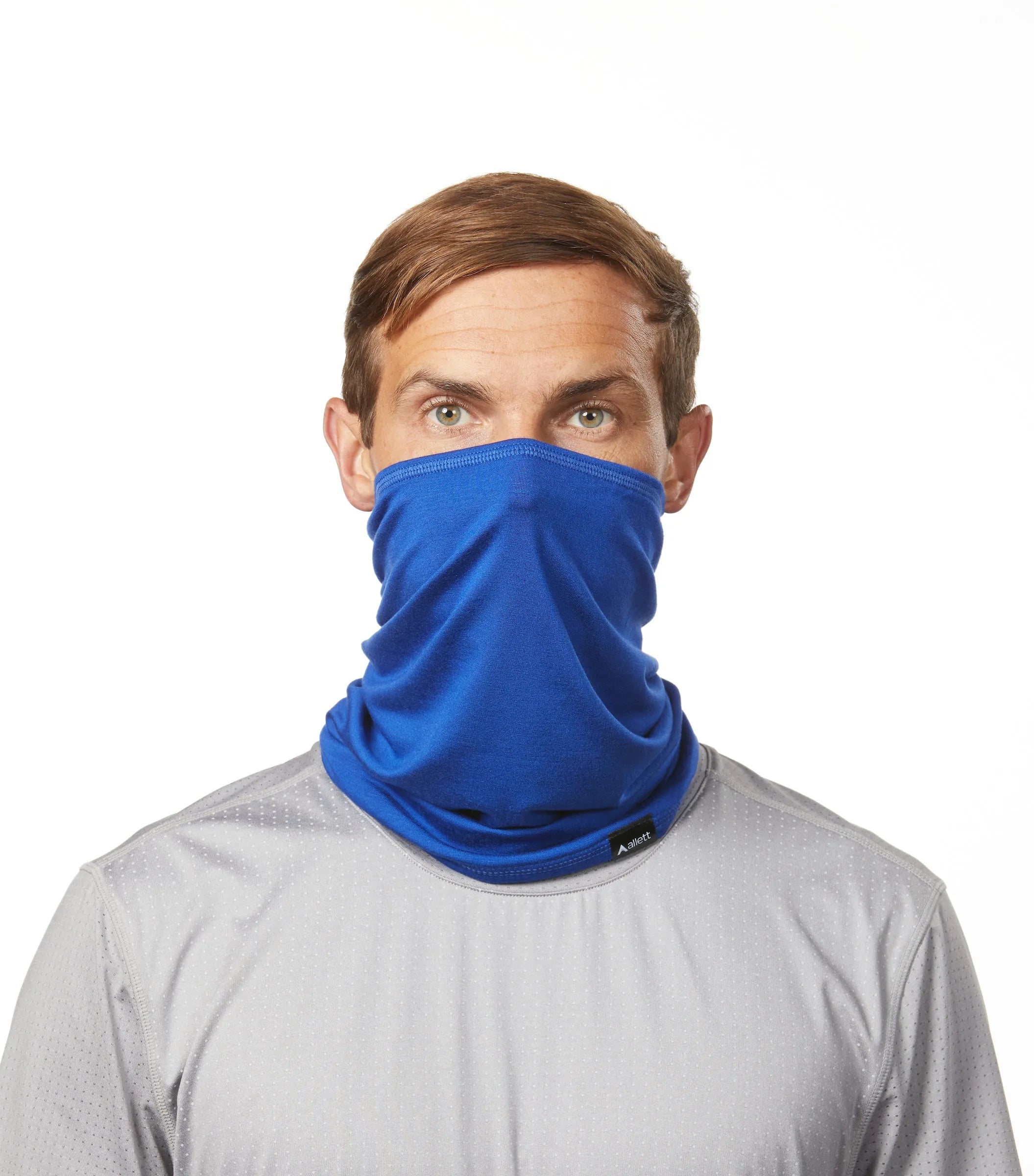 Man facing forward wearing a fabric neck gaiter in cobalt blue color. cobalt-blue