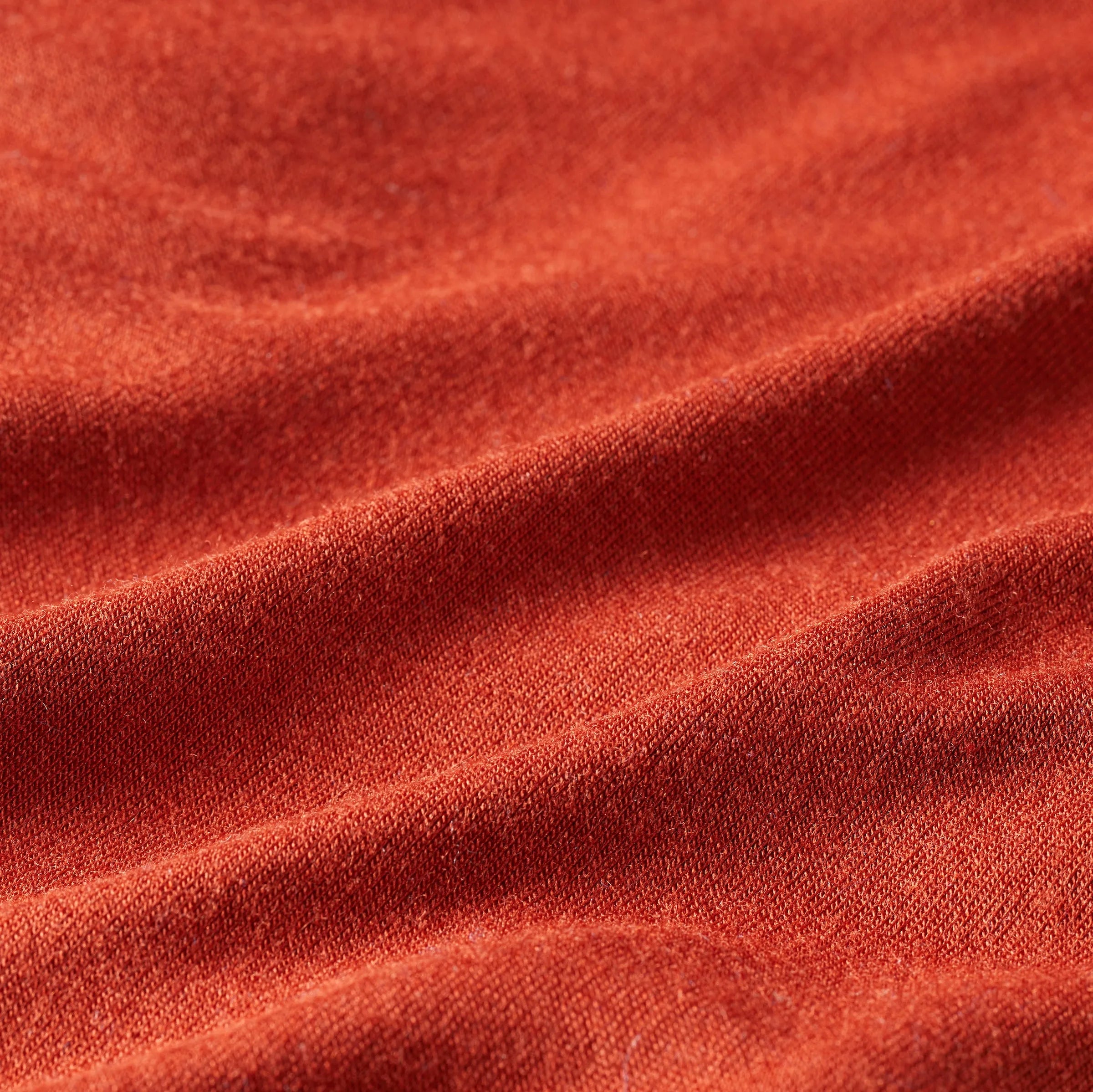 Concept of the reddish rust colored fabric that is used by the neck gaiters created by Allett. rust