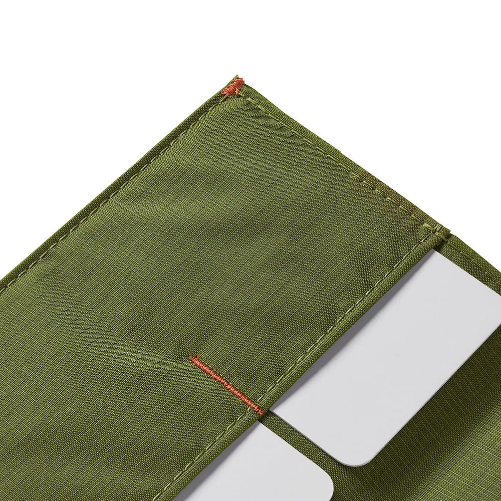 Detailed view of the corner and details of a Allett The Original RFID blocking minimalist wallet cala-green