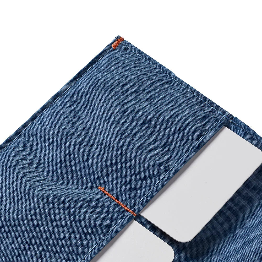 Close up of the corner of the Allett Wallet original nylon wallet in indigo-blue