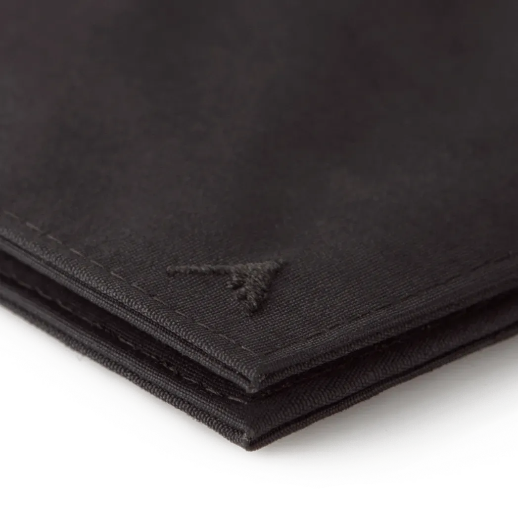 Sharp corner of the black vegan nylon wallet zoomed in on the Allett logo. Allett Lookout Nylon Wallet - black