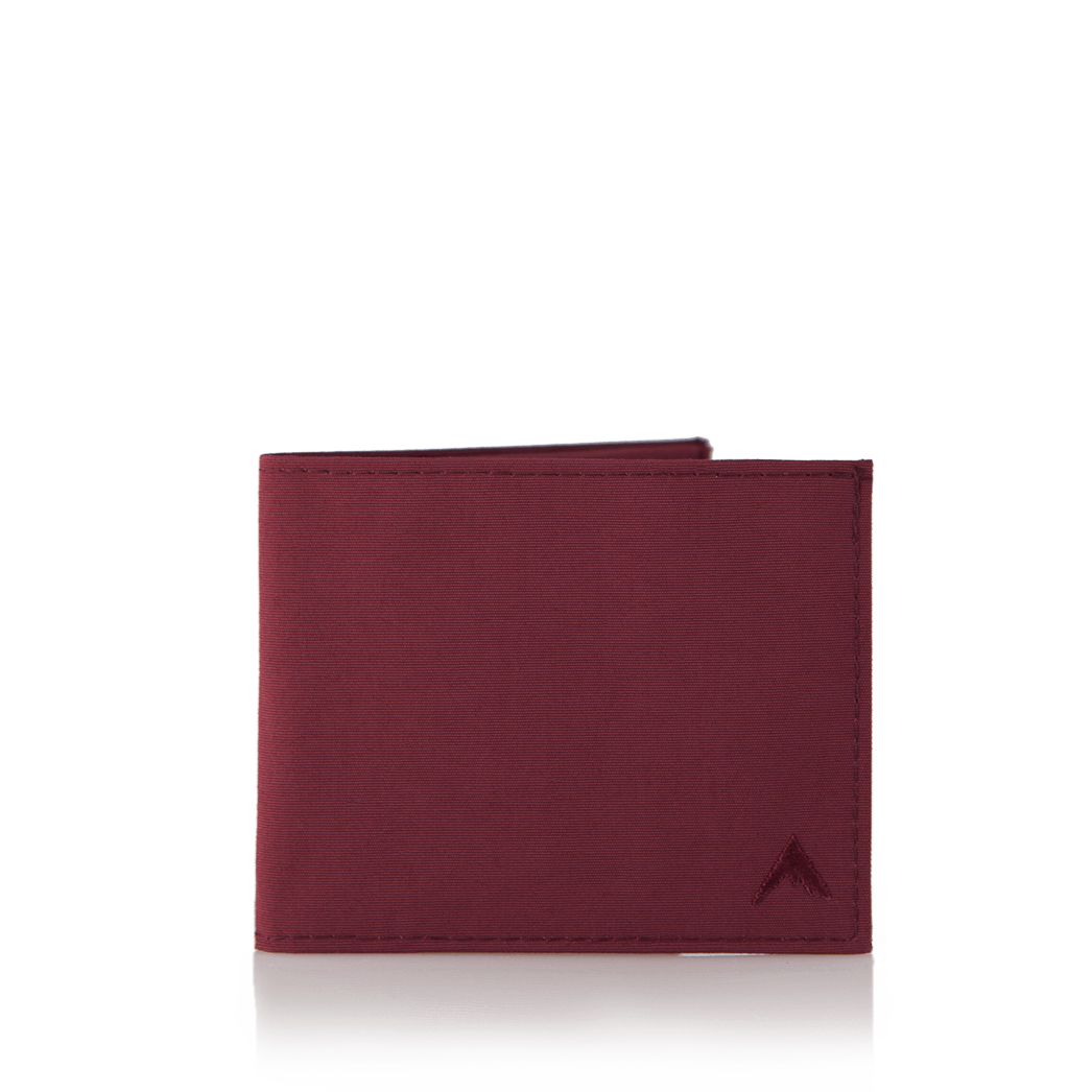Oxblood nylon "Lookout" wallet, closed and standing out against a clean white background. Allett Lookout Nylon Wallet - oxblood