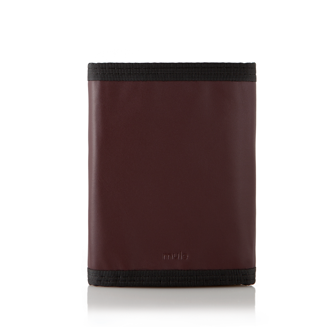 The reverse side of the oxblood leather "Switchback" trifold wallet, shut, and displayed against a bright white setting. Allett Switchback Leather Wallet - oxblood