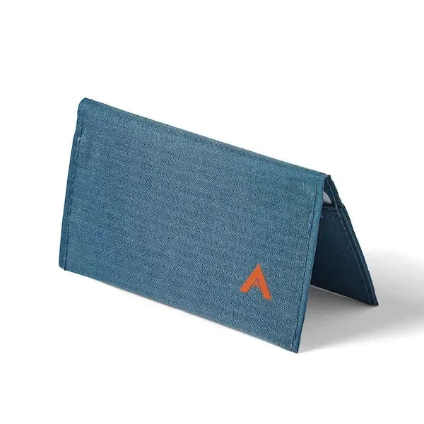 Vegan nylon card wallet in indigo blue from Allett, arranged pyramidically on a pristine white base to highlight its dimensions. - indigo-blue