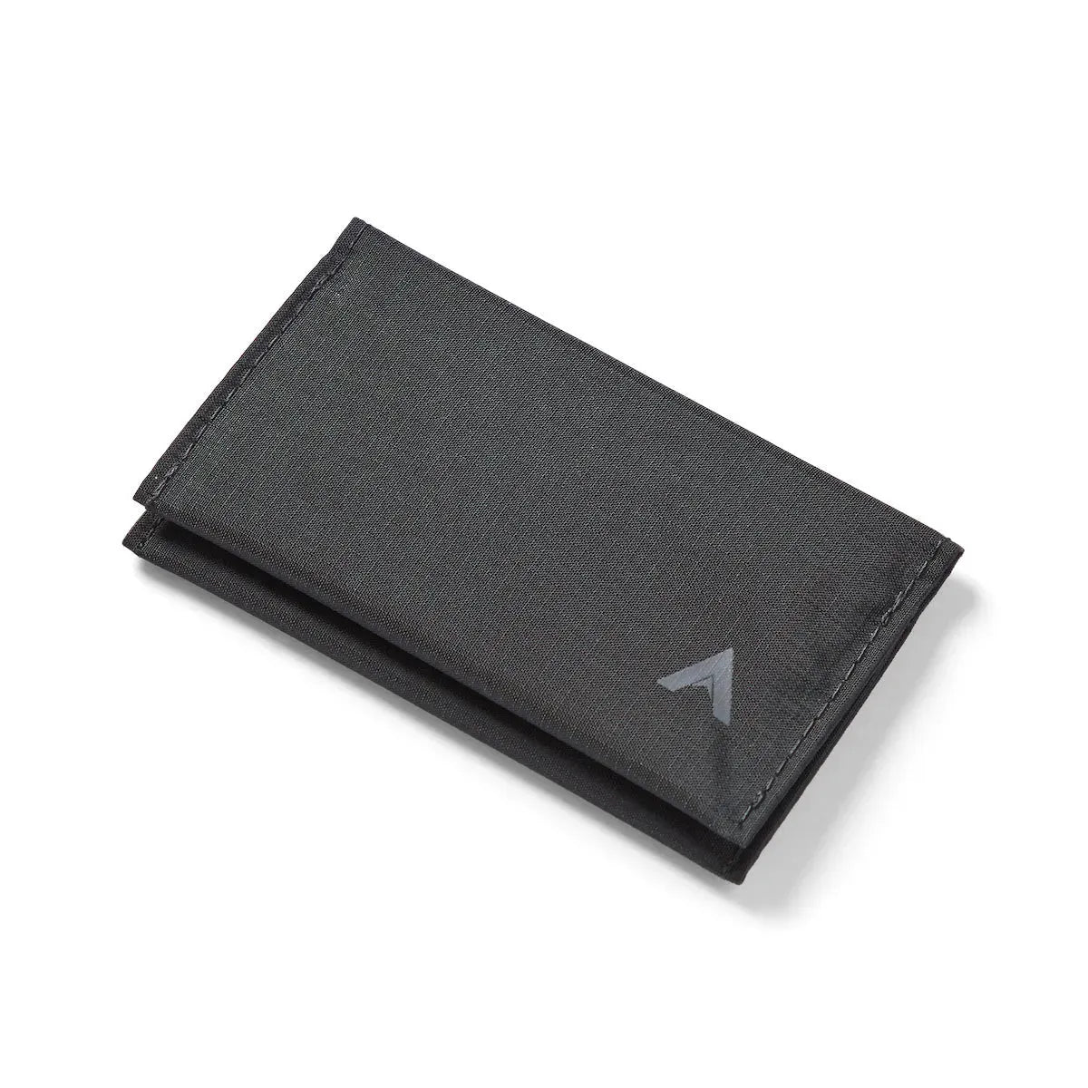 Vegan jet black card wallet made of ripstop nylon by Allett, resting shut on a stark white backdrop. - jet-black